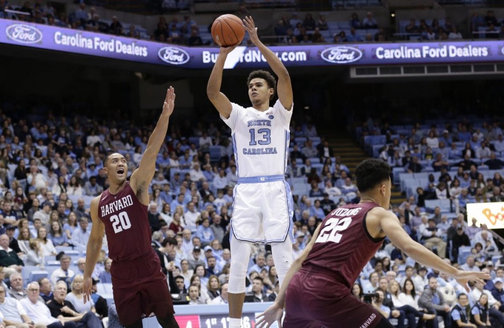 Nov 22, 2024; Philadelphia, Pennsylvania, USA; Brooklyn Nets forward Cameron Johnson (2) drives for a shot past Philadelphia 76ers forward Caleb Martin (16) during the first quarter at Wells Fargo Center. Mandatory Credit: Bill Streicher-Imagn Images  
