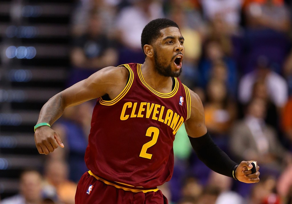 PHOENIX, AZ - MARCH 12:  Kyrie Irving #2 of the Cleveland Cavaliers celebrates after scoring against the Phoenix Suns during the second half of the NBA game at US Airways Center on March 12, 2014 in Phoenix, Arizona.  NOTE TO USER: User expressly acknowledges and agrees that, by downloading and or using this photograph, User is consenting to the terms and conditions of the Getty Images License Agreement.  (Photo by Christian Petersen/Getty Images)