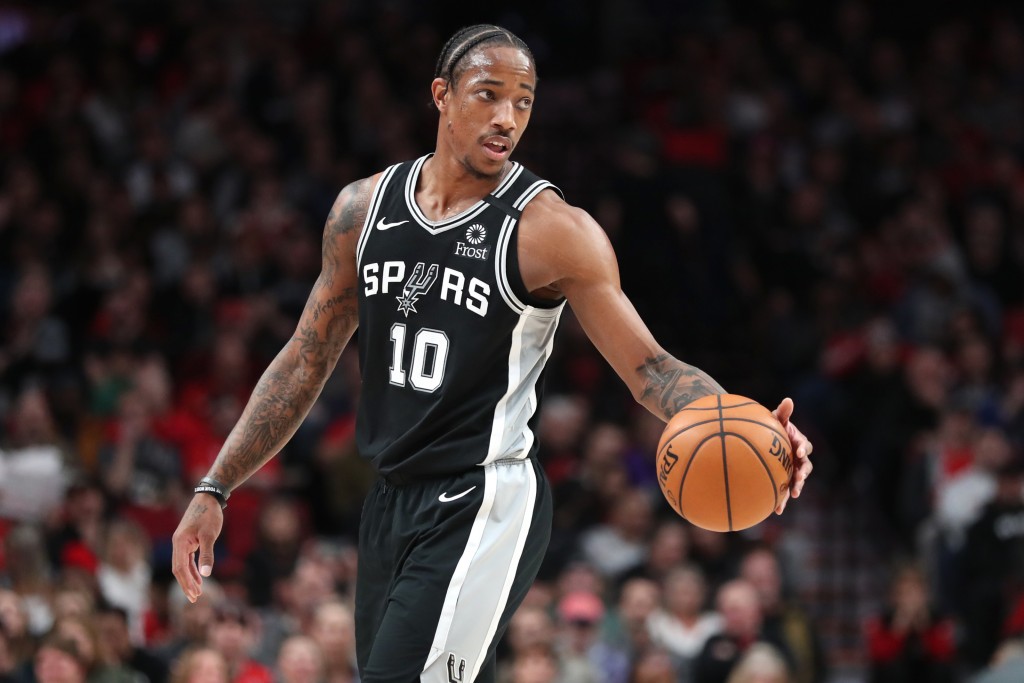 Sacramento, California, USA; Sacramento Kings forward DeMar DeRozan (10) dribbles the ball up the court during the first quarter against the Houston Rockets at Golden 1 Center. Mandatory Credit: Sergio Estrada-Imagn Images