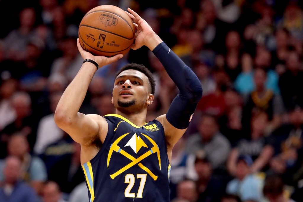 Nov 25, 2024; Denver, Colorado, USA; Denver Nuggets guard Jamal Murray (27) dribbles the ball in the first quarter against the New York Knicks at Ball Arena. Mandatory Credit: Ron Chenoy-Imagn Images