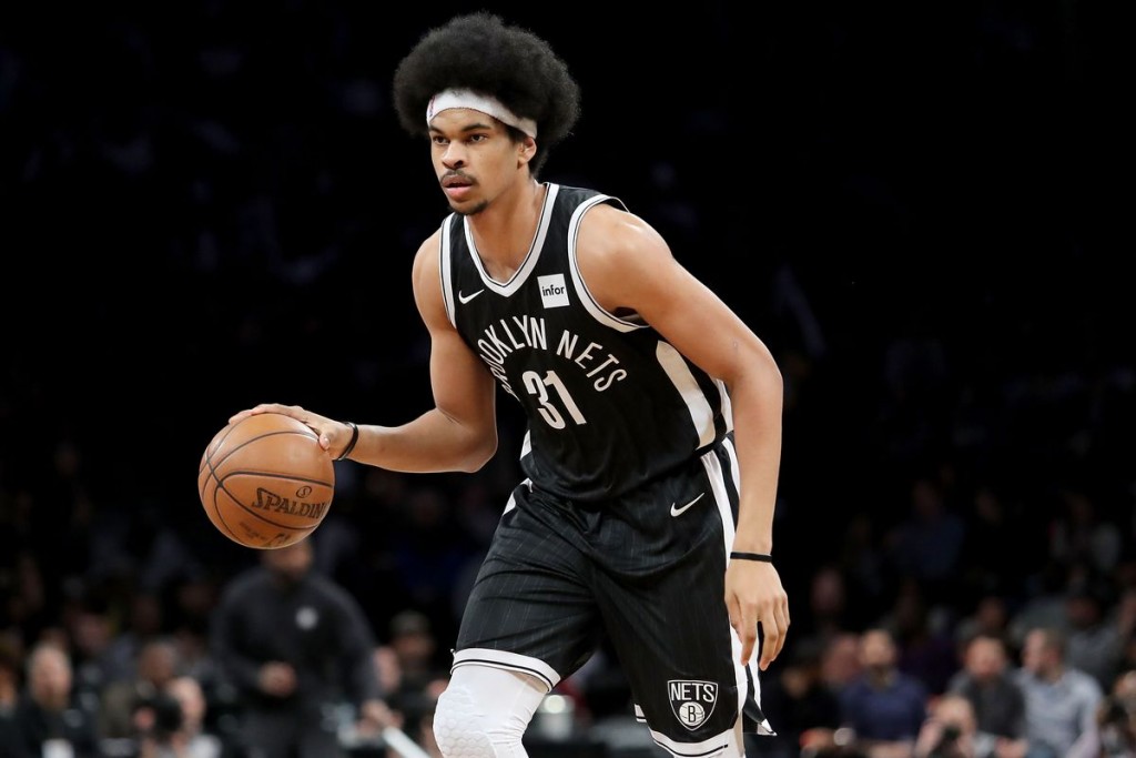 Aug 5, 2020; Lake Buena Vista, Florida, USA; Brooklyn Nets center Jarrett Allen (31) passes around Boston Celtics center Daniel Theis (27) during the first half of an NBA basketball game Wednesday, Aug. 5, 2020 in Lake Buena Vista, Fla. at The Arena.