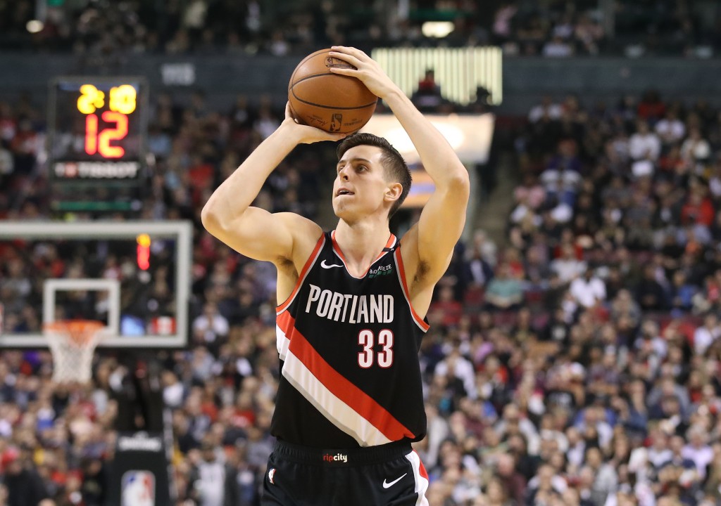 Oct 30, 2024; Oklahoma City, Oklahoma, USA; San Antonio Spurs forward Zach Collins (23) drives to the basket beside Oklahoma City Thunder forward Chet Holmgren (7) during the second quarter at Paycom Center.