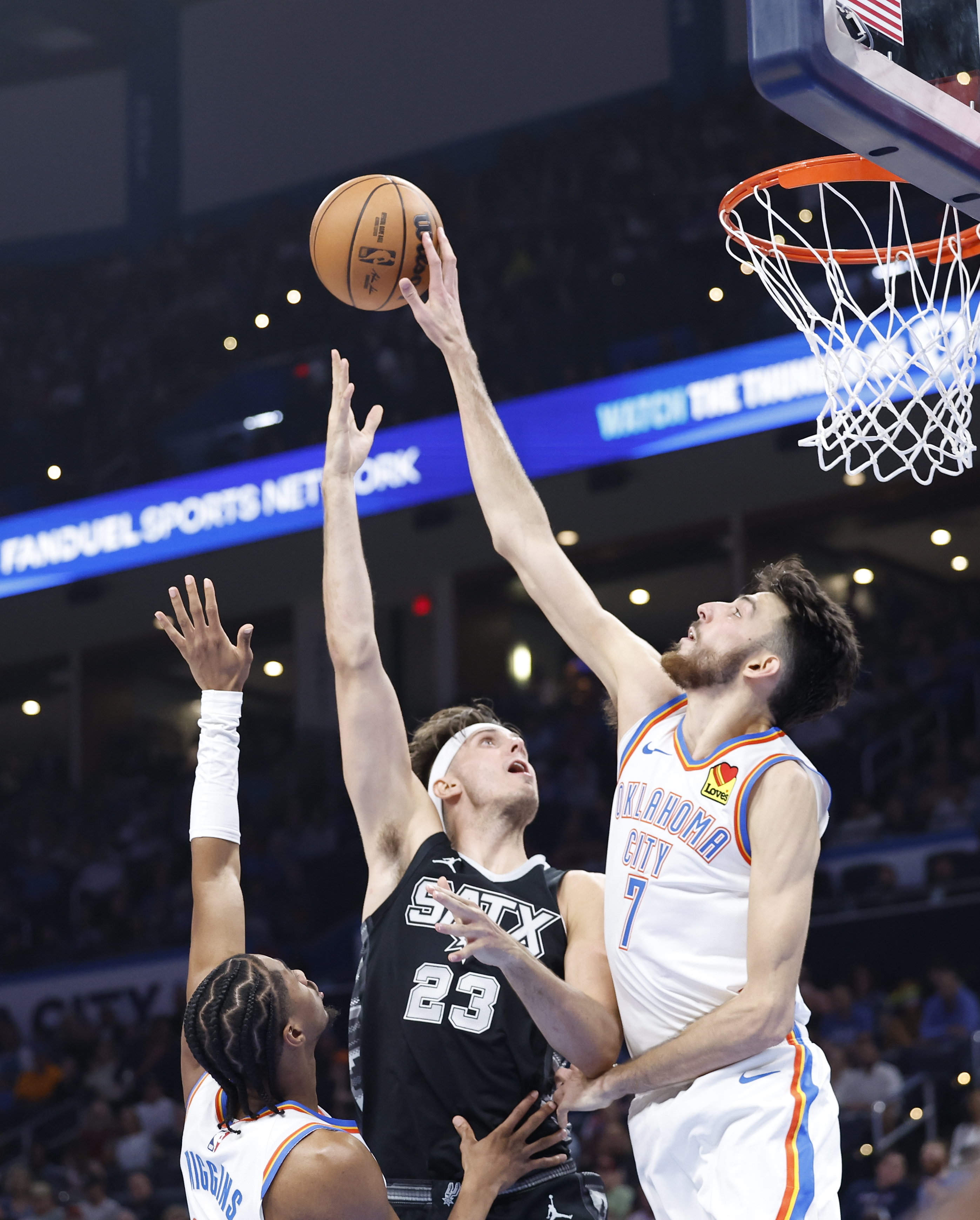 Oct 30, 2024; Oklahoma City, Oklahoma, USA; Oklahoma City Thunder forward Chet Holmgren (7) blocks a shot by San Antonio Spurs forward Zach Collins (23) during the second quarter at Paycom Center.