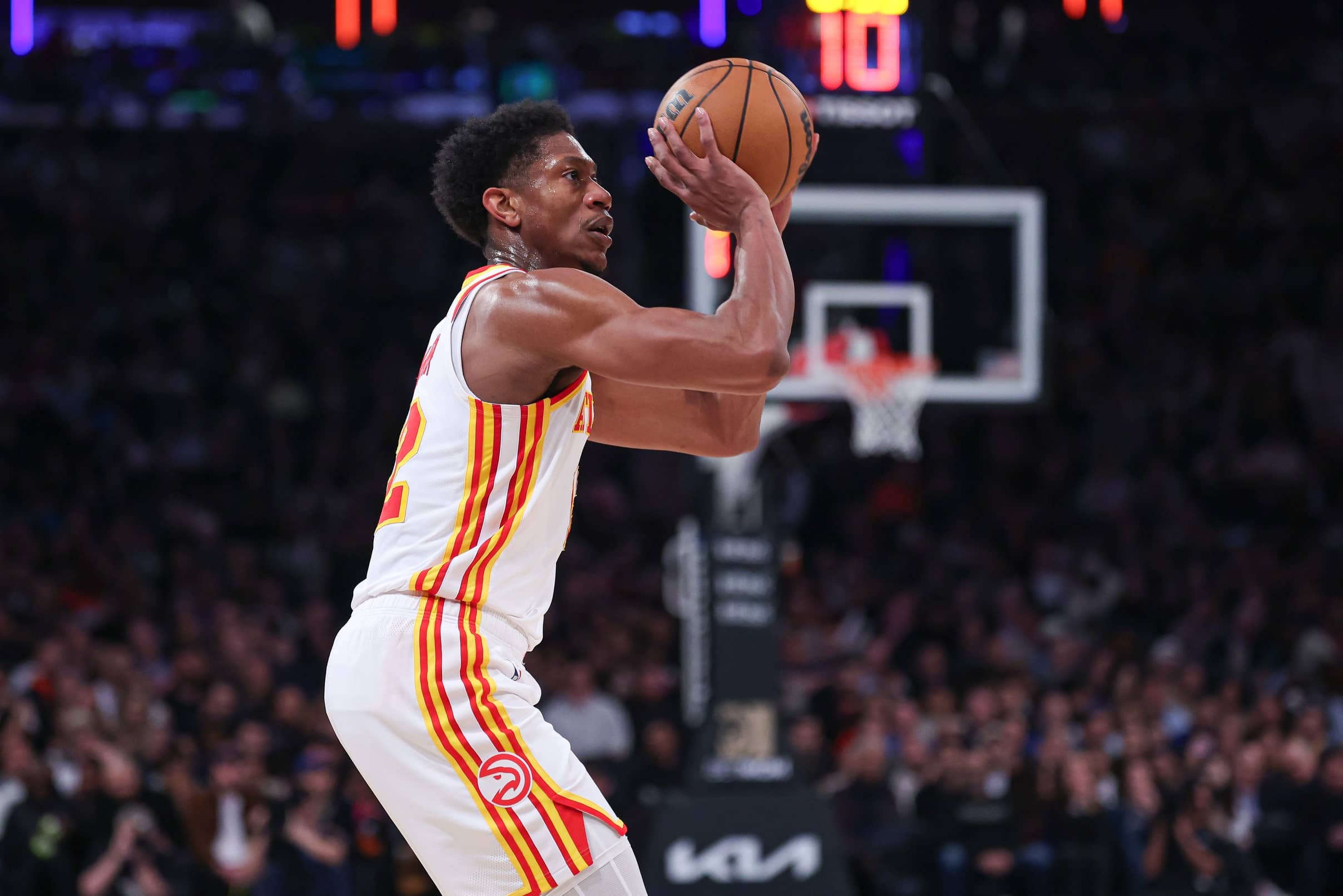 Oct 25, 2024; Atlanta, Georgia, USA; Atlanta Hawks forward De’Andre Hunter (12) shoots against Charlotte Hornets forward Miles Bridges (0) during the fourth quarter at State Farm Arena.