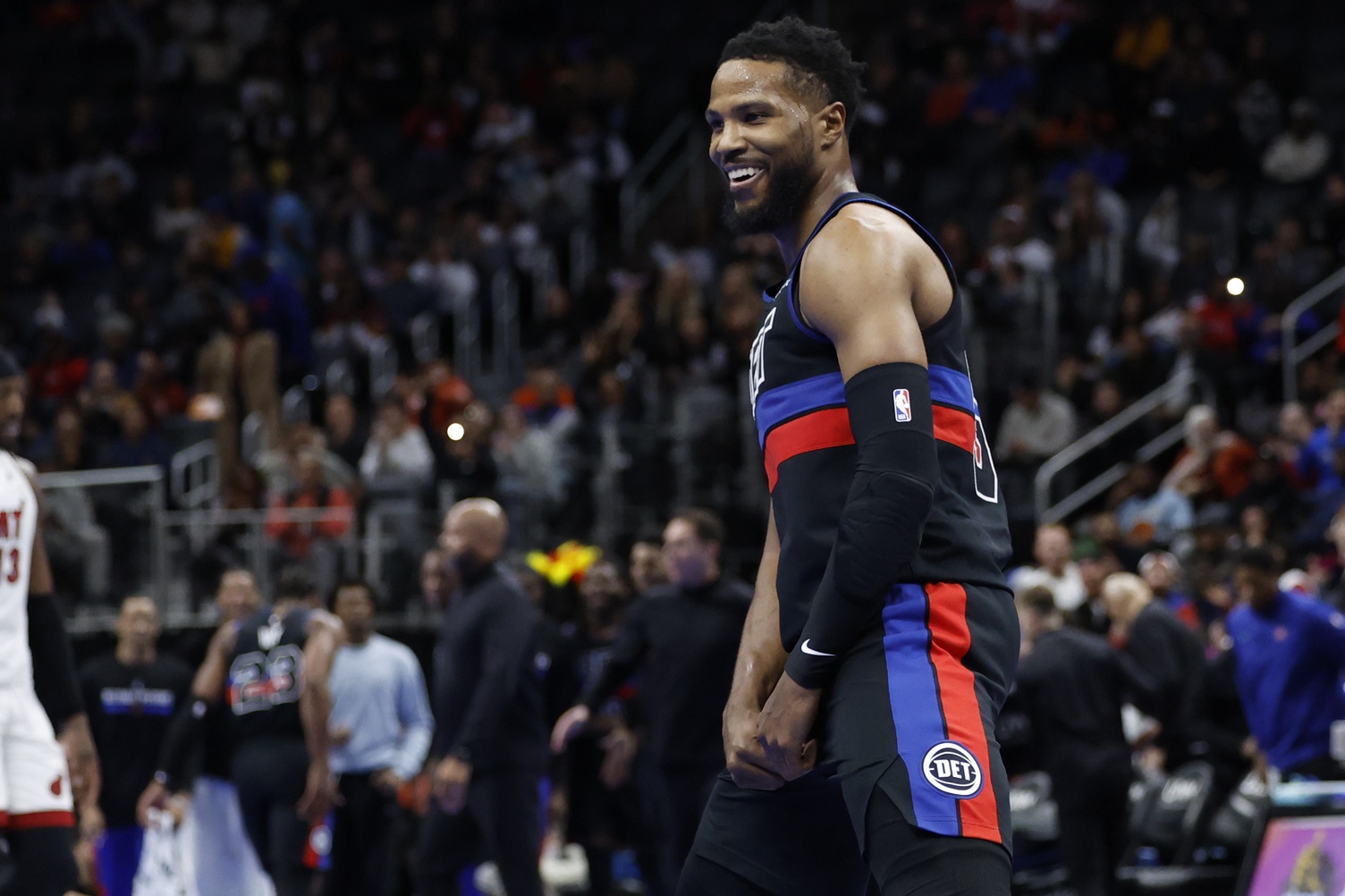 Nov 12, 2024; Detroit, Michigan, USA; Detroit Pistons guard Malik Beasley (5) celebrates in the second half against the Miami Heat at Little Caesars Arena. 