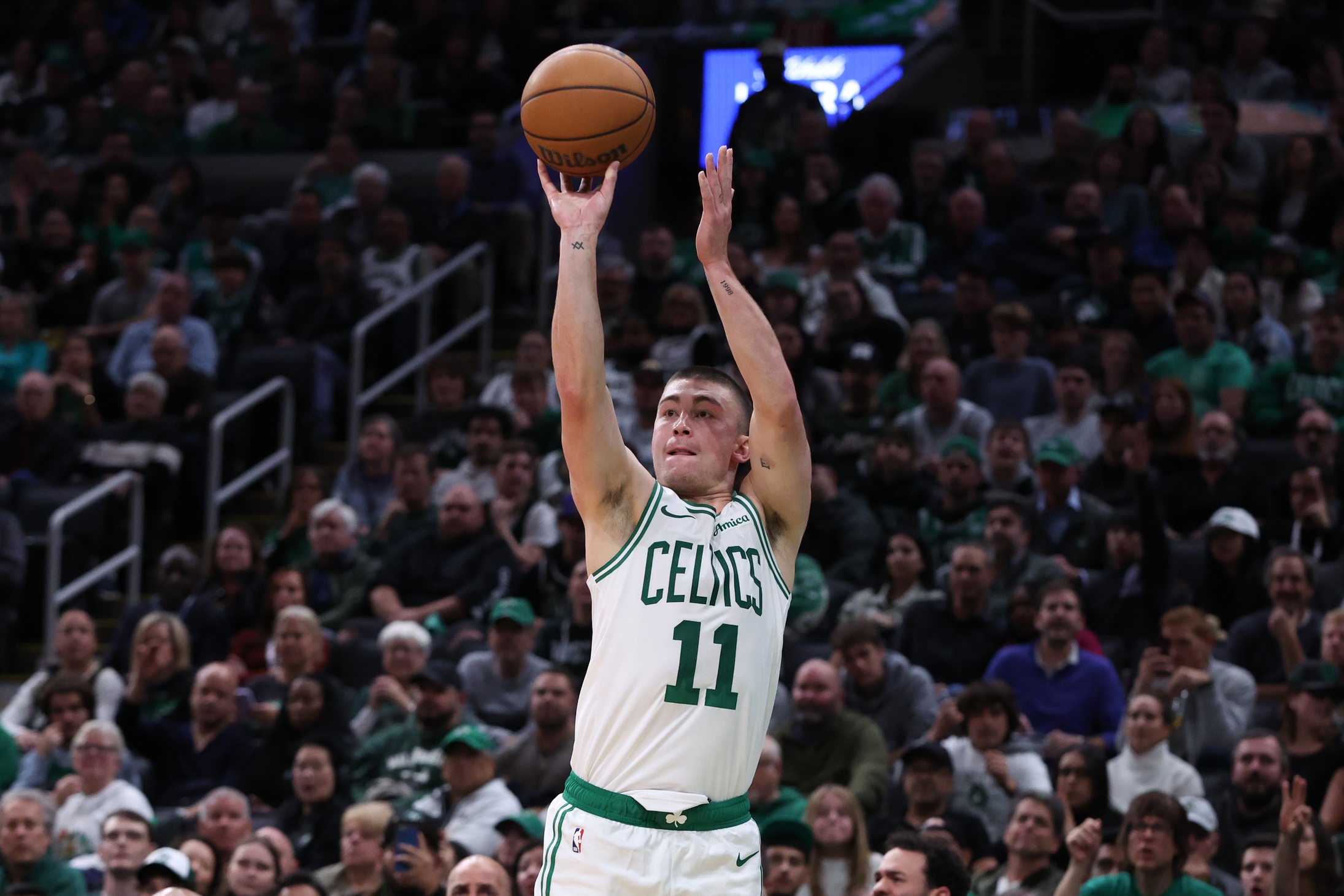 Boston, Massachusetts, USA; Boston Celtics guard Payton Pritchard (11) brings the ball up court against the Miami Heat during the second half at TD Garden. Mandatory Credit: Winslow Townson-Imagn Images