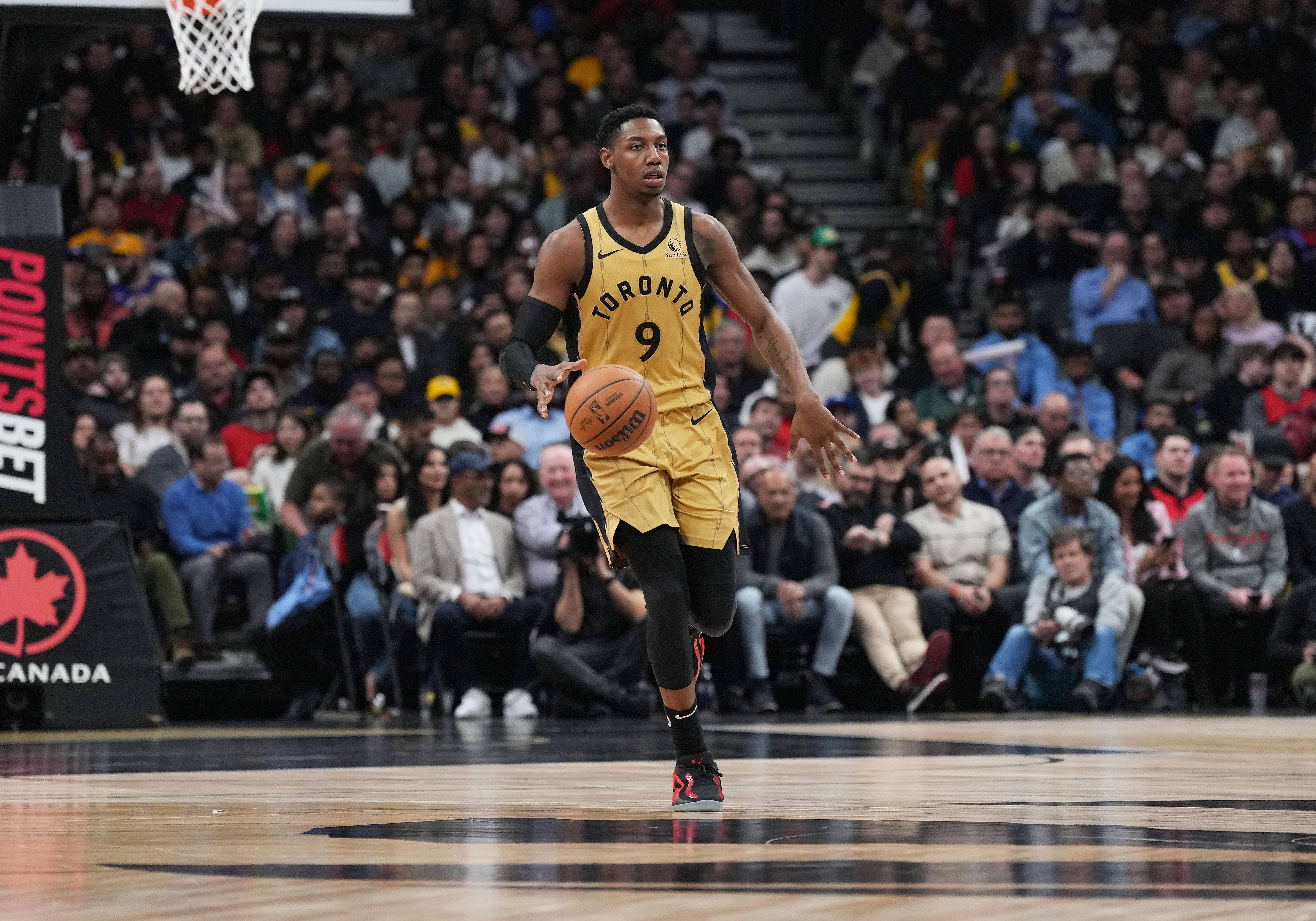 Apr 2, 2024; Toronto, Ontario, CAN; Toronto Raptors guard RJ Barrett (9) dribbles the ball upcourt against the Los Angeles Lakers during the third quarter at Scotiabank Arena.