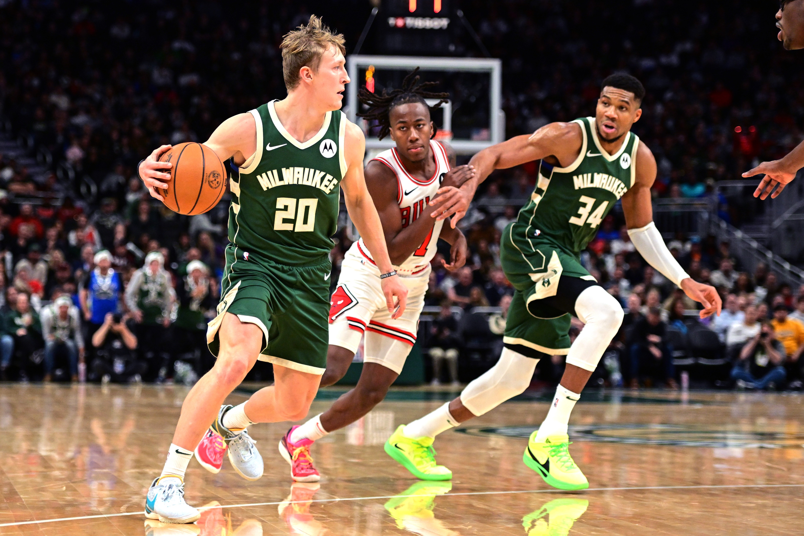 Nov 20, 2024; Milwaukee, Wisconsin, USA; Milwaukee Bucks guard AJ Green (20) looks to pass the ball in the third quarter against the Chicago Bulls at Fiserv Forum.