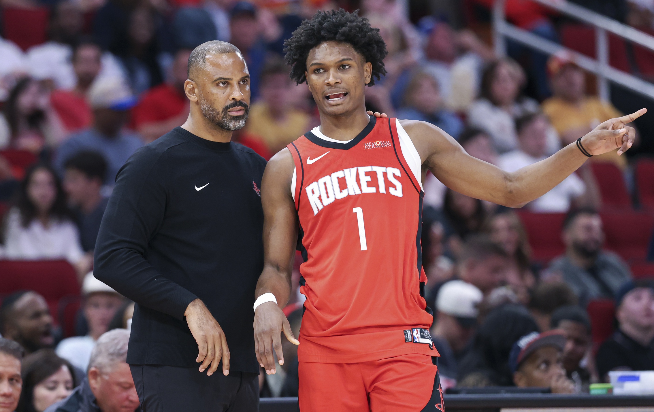 Houston Rockets head coach Ime Udoka talks with forward Amen Thompson (1) during the third quarter against the Memphis Grizzlies at Toyota Center. Mandatory Credit: Troy Taormina-Imagn Images