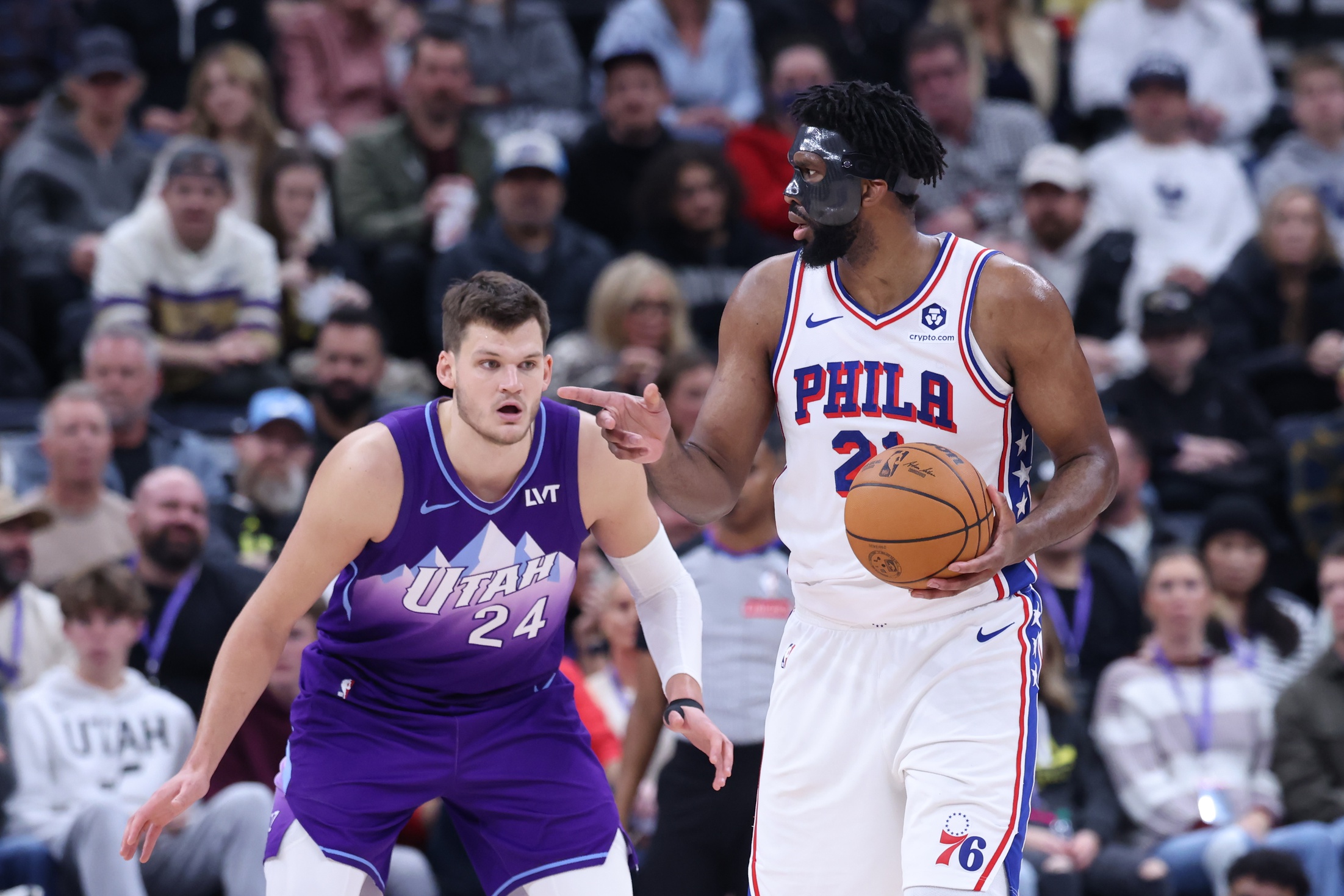 Philadelphia 76ers center Joel Embiid (21) looks for a play against Utah Jazz center Walker Kessler (24) during the third quarter at Delta Center. Mandatory Credit: Rob Gray-Imagn Images