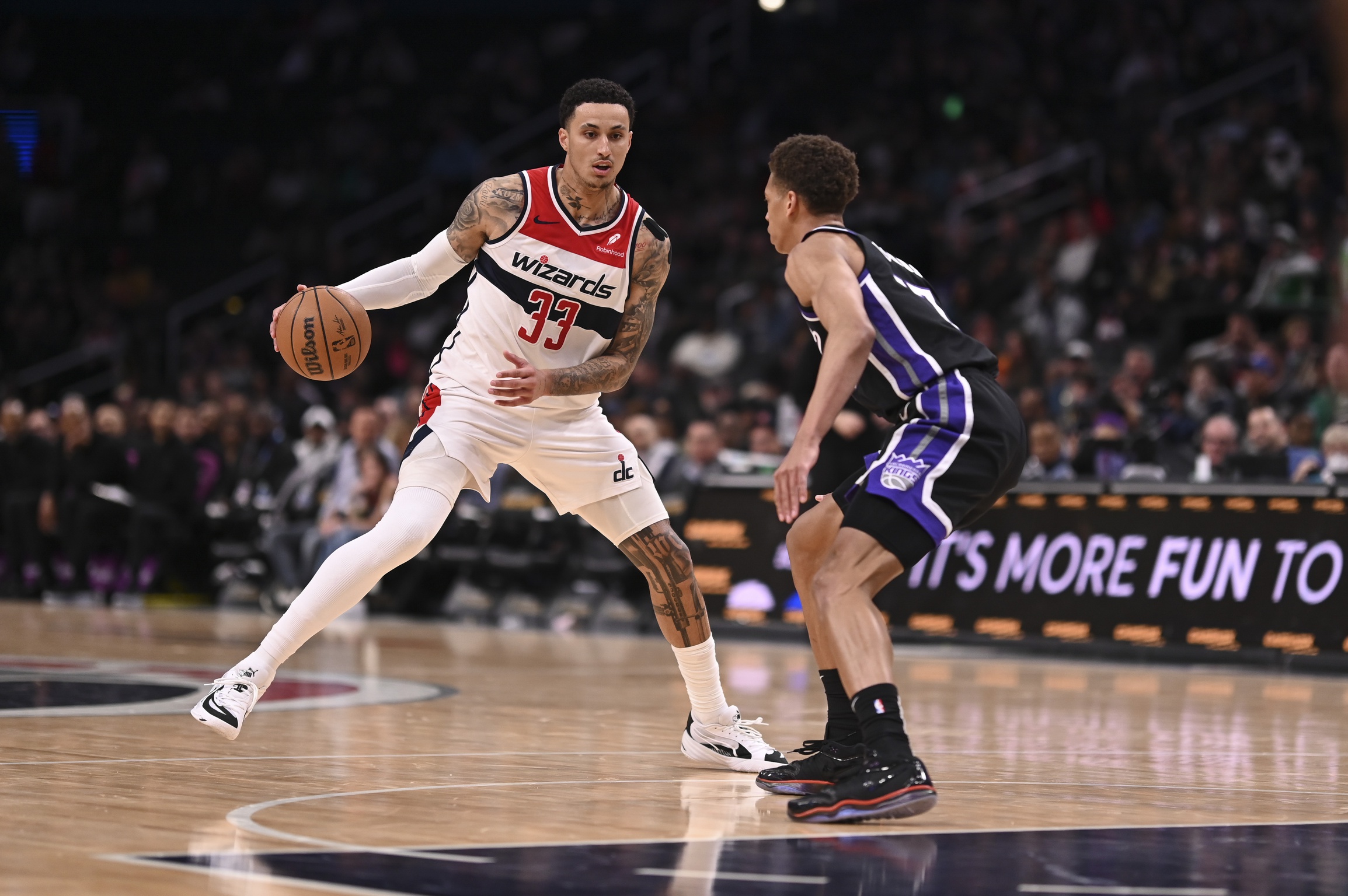 Washington Wizards forward Kyle Kuzma (33) makes a move on Sacramento Kings forward Keegan Murray (13) during the second half at Capital One Arena. Mandatory Credit: Tommy Gilligan-Imagn Images