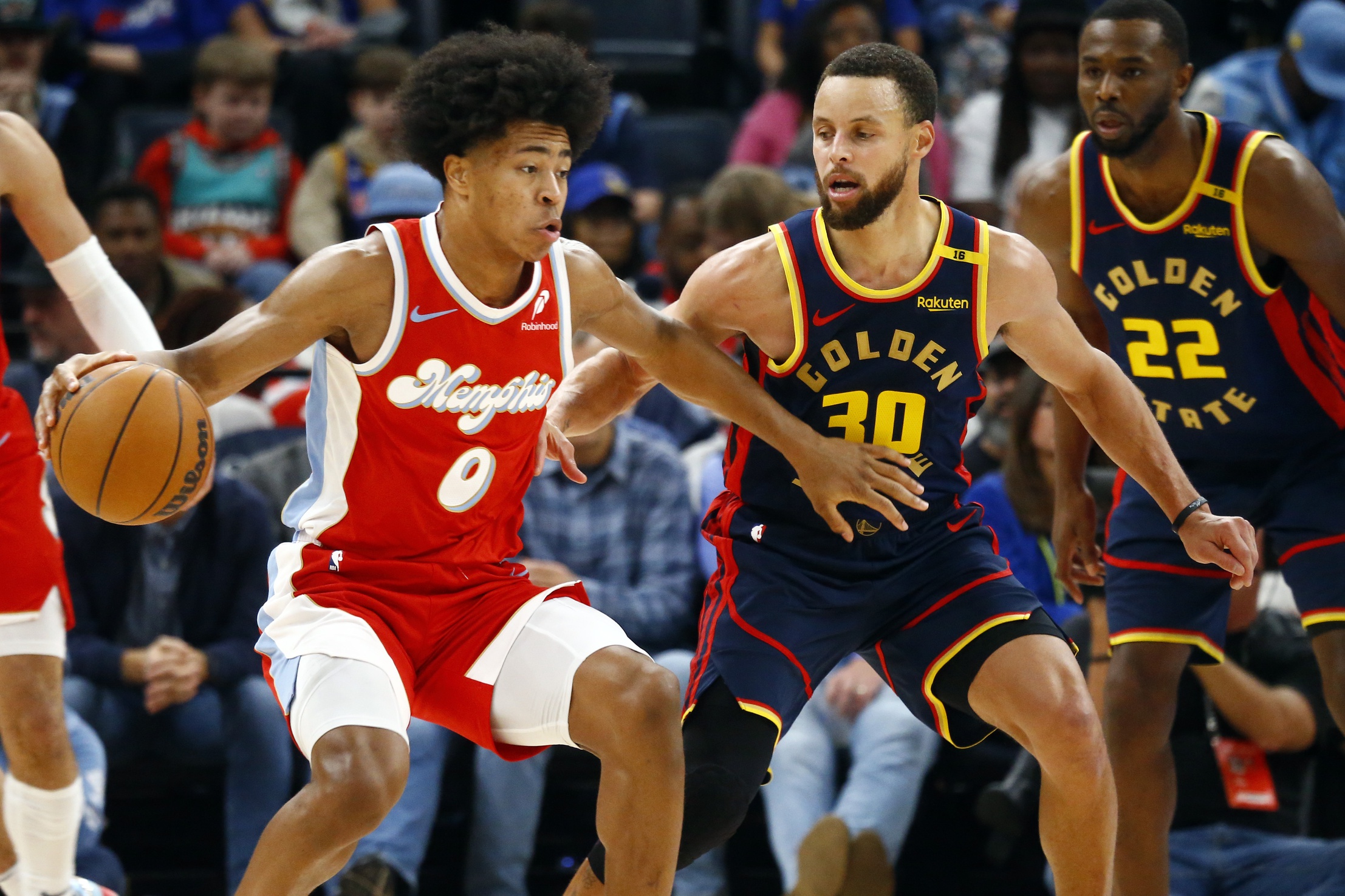 Memphis Grizzlies forward Jaylen Wells (0) dribbles as Golden State Warriors guard Stephen Curry (30) defends during the third quarter at FedExForum. Mandatory Credit: Petre Thomas-Imagn Images