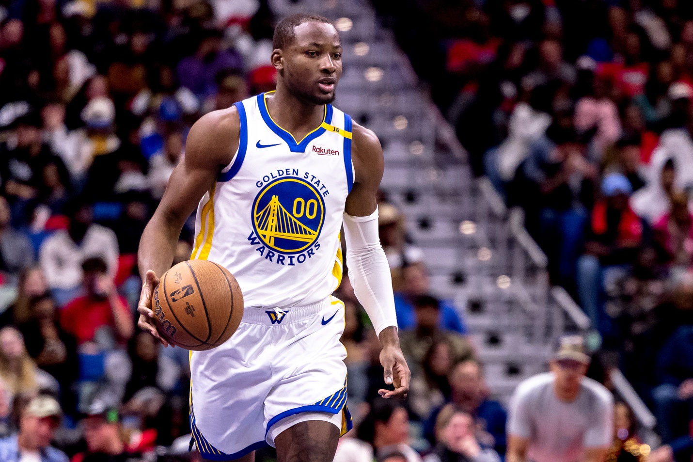 Golden State Warriors forward Jonathan Kuminga (00) brings the ball up court against the New Orleans Pelicans during second half at Smoothie King Center. Mandatory Credit: Stephen Lew-Imagn Images
