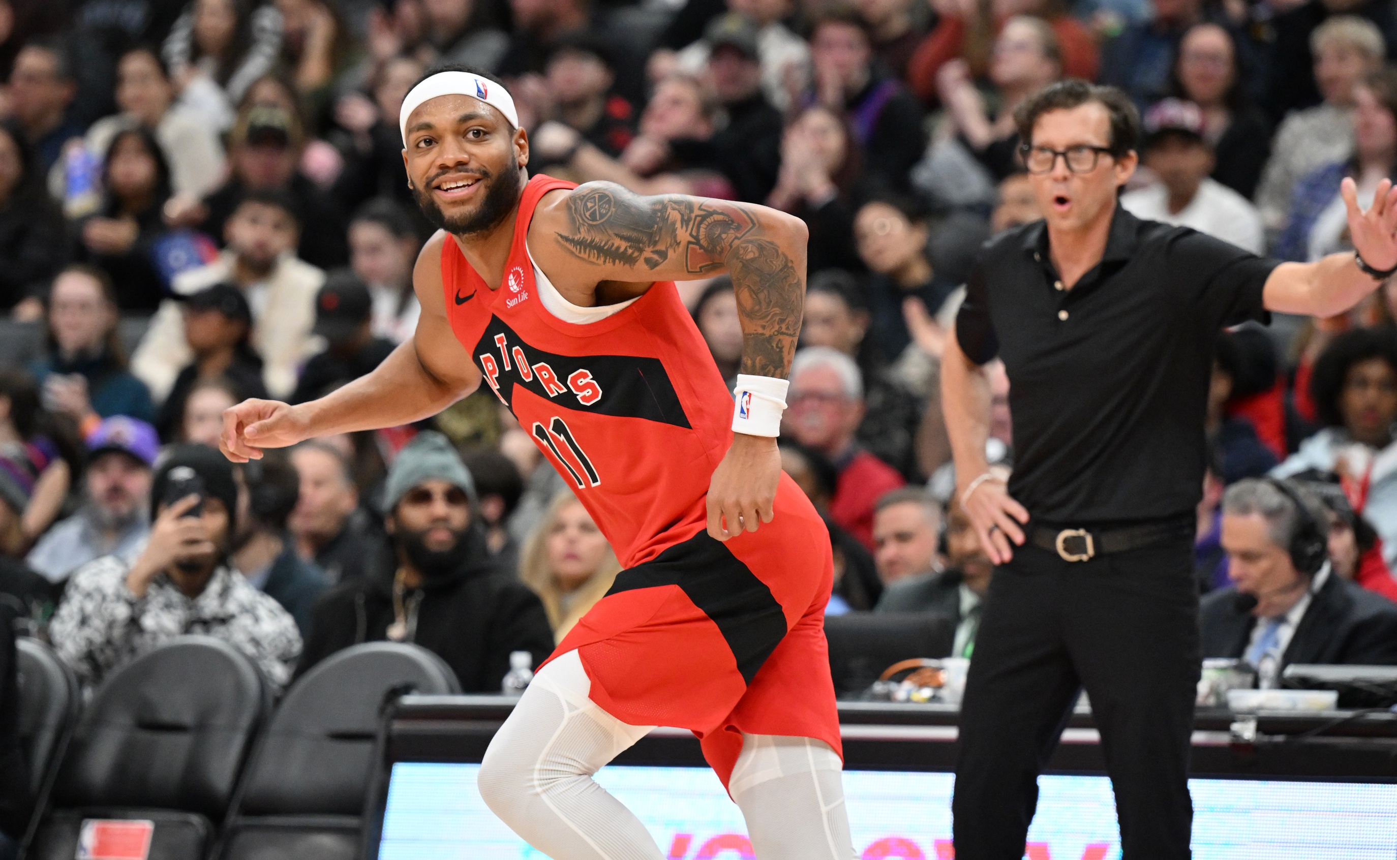 Toronto Raptors guard Bruce Brown (11) reacts after scoring a basket against the Atlanta Hawks in the second half at Scotiabank Arena. Mandatory Credit: Dan Hamilton-Imagn Images