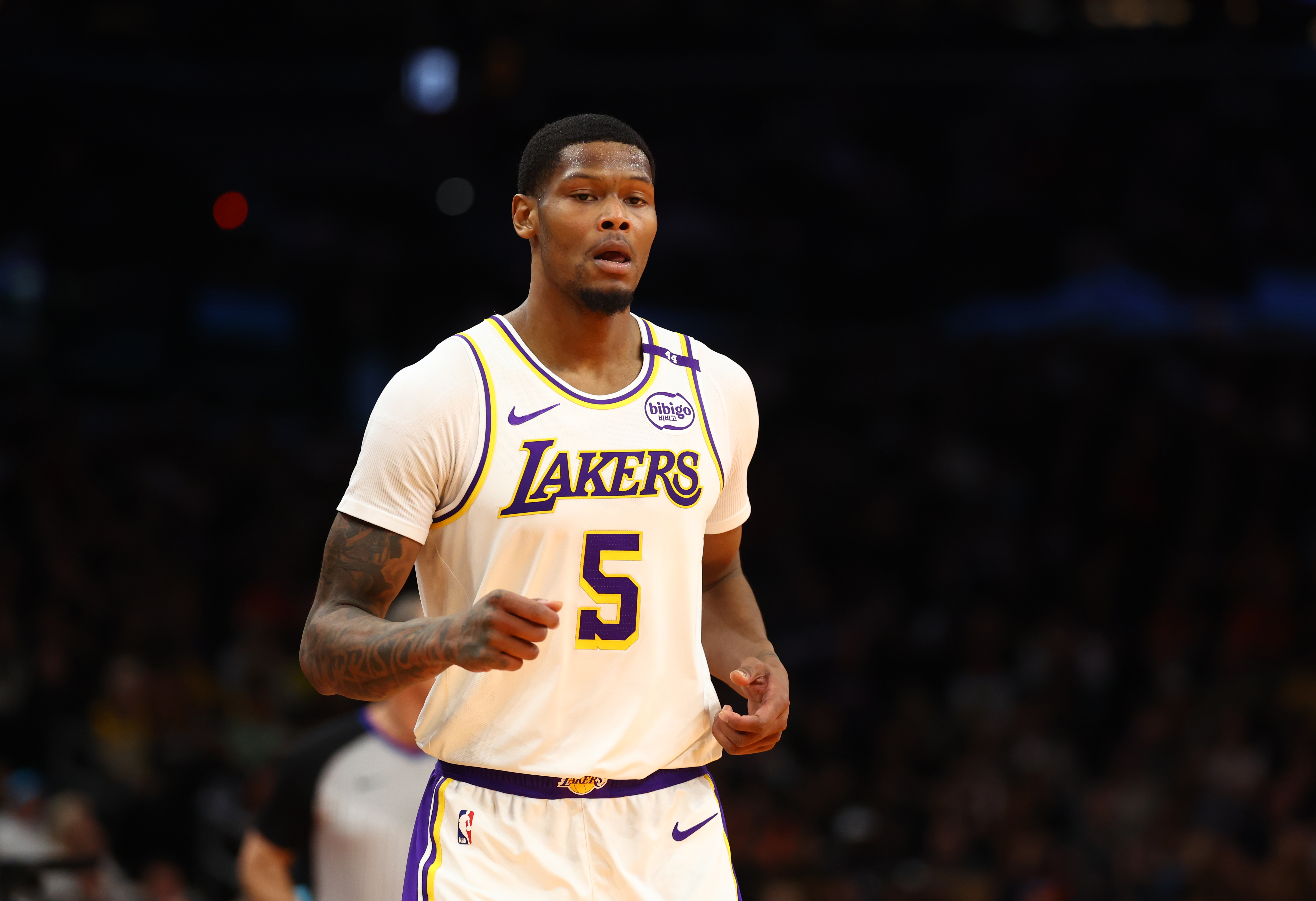 Nov 26, 2024; Phoenix, Arizona, USA; Los Angeles Lakers forward Cam Reddish (5) against the Phoenix Suns during an NBA Cup game at Footprint Center. Mandatory Credit: Mark J. Rebilas-Imagn Images  