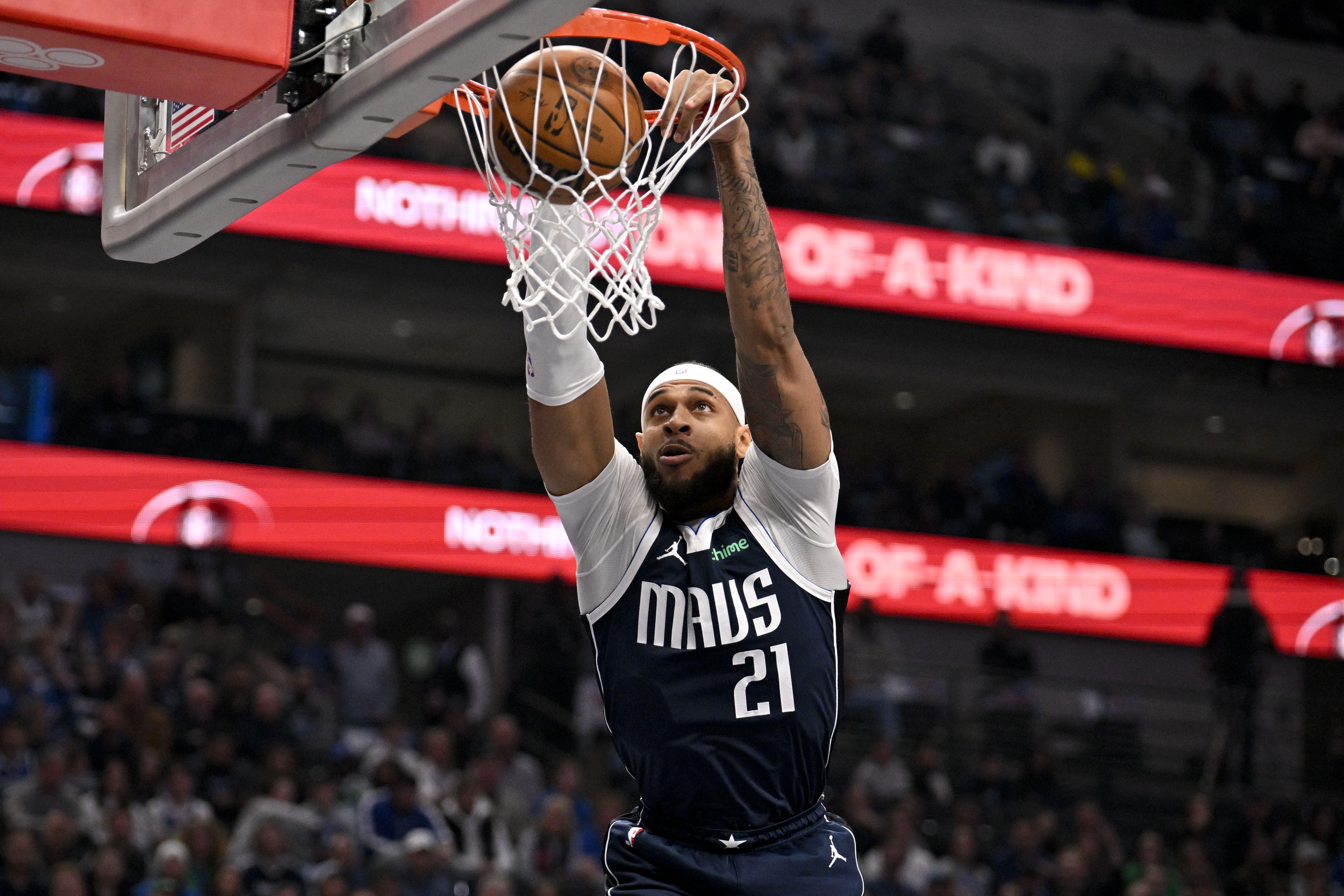Jan 12, 2025; Dallas, Texas, USA; Dallas Mavericks center Daniel Gafford (21) dunks the ball during the first quarter against the Denver Nuggets at the American Airlines Center. Mandatory Credit: Jerome Miron-Imagn Images  