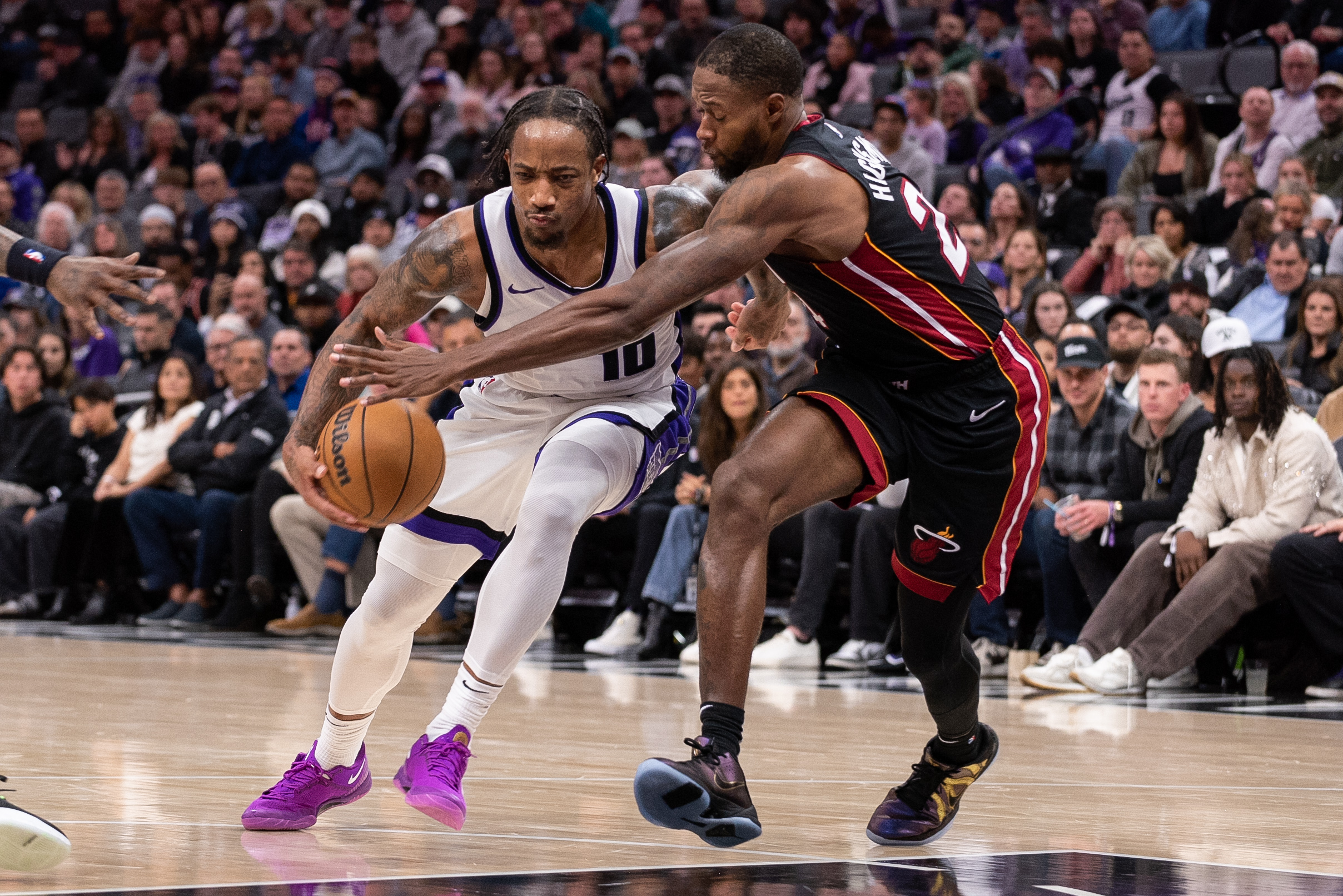 Nov 11, 2024; San Antonio, Texas, USA; Sacramento Kings guard DeMar DeRozan (10) shoots over San Antonio Spurs guard Stephon Castle (5) during the second half at Frost Bank Center. Mandatory Credit: Scott Wachter-Imagn Images