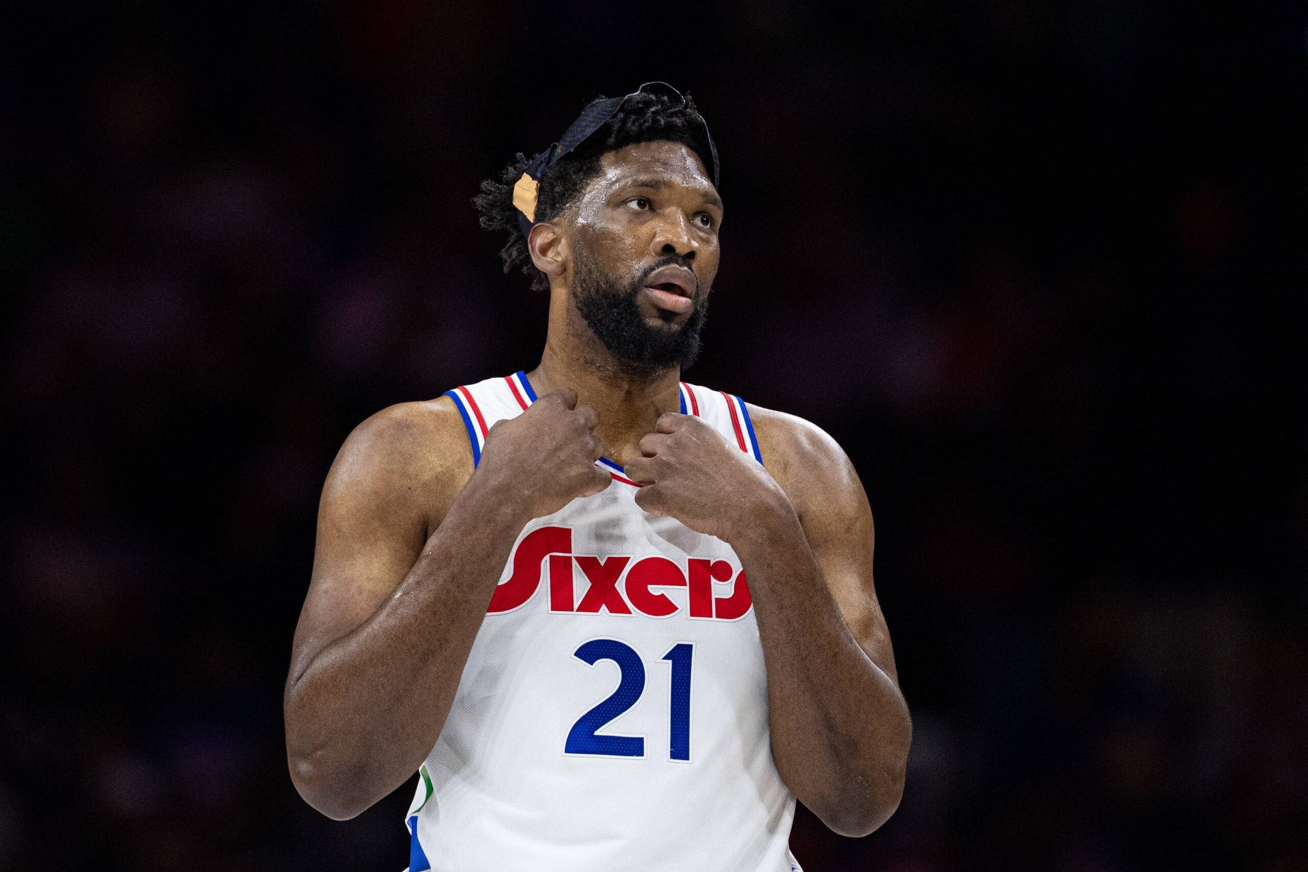 Philadelphia 76ers center Joel Embiid (21) looks on during the first quarter against the San Antonio Spurs at Wells Fargo Center. Mandatory Credit: Bill Streicher-Imagn Images