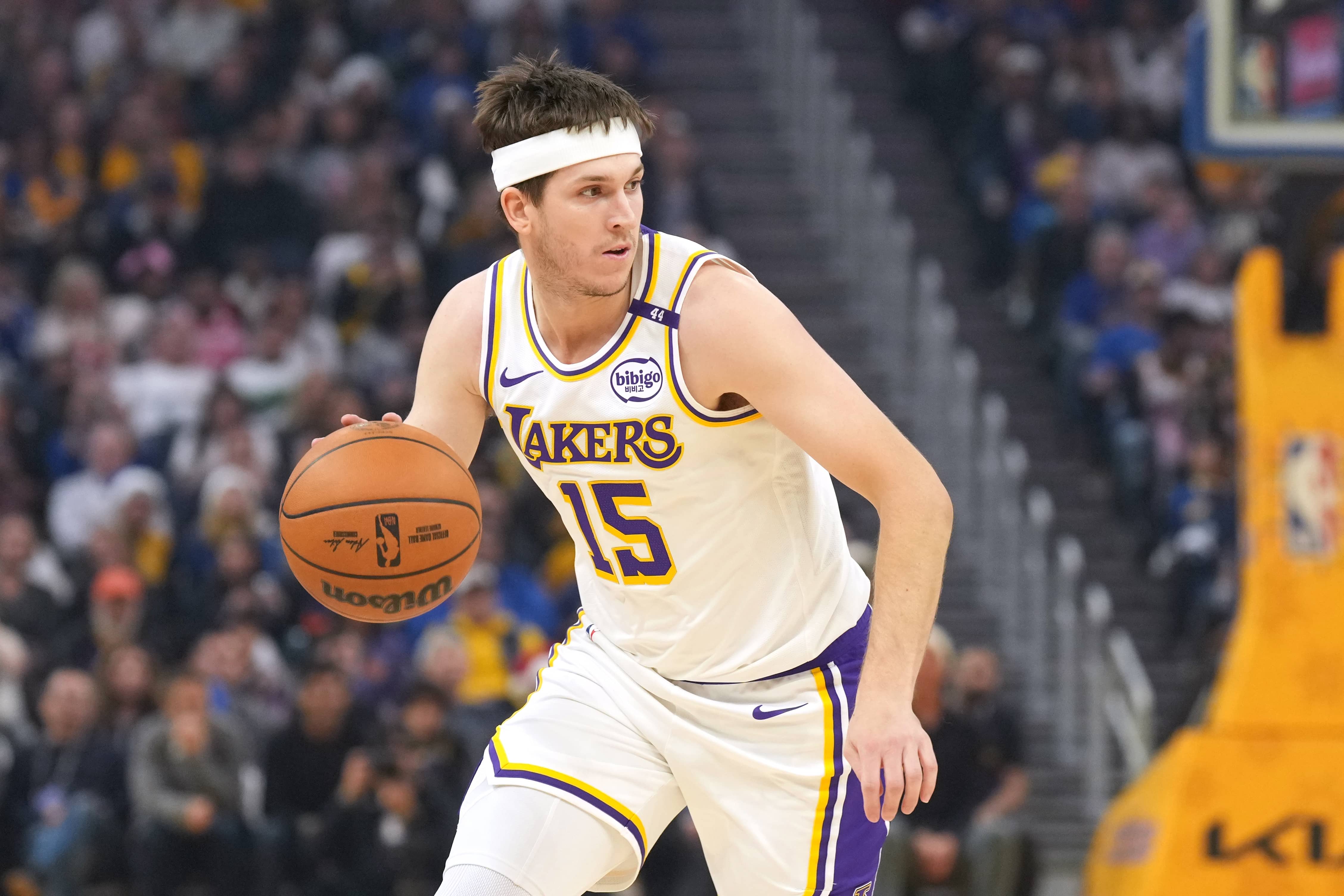 San Francisco, California, USA; Los Angeles Lakers guard Austin Reaves (15) dribbles against the Golden State Warriors during the first quarter at Chase Center. Mandatory Credit: Darren Yamashita-Imagn Images