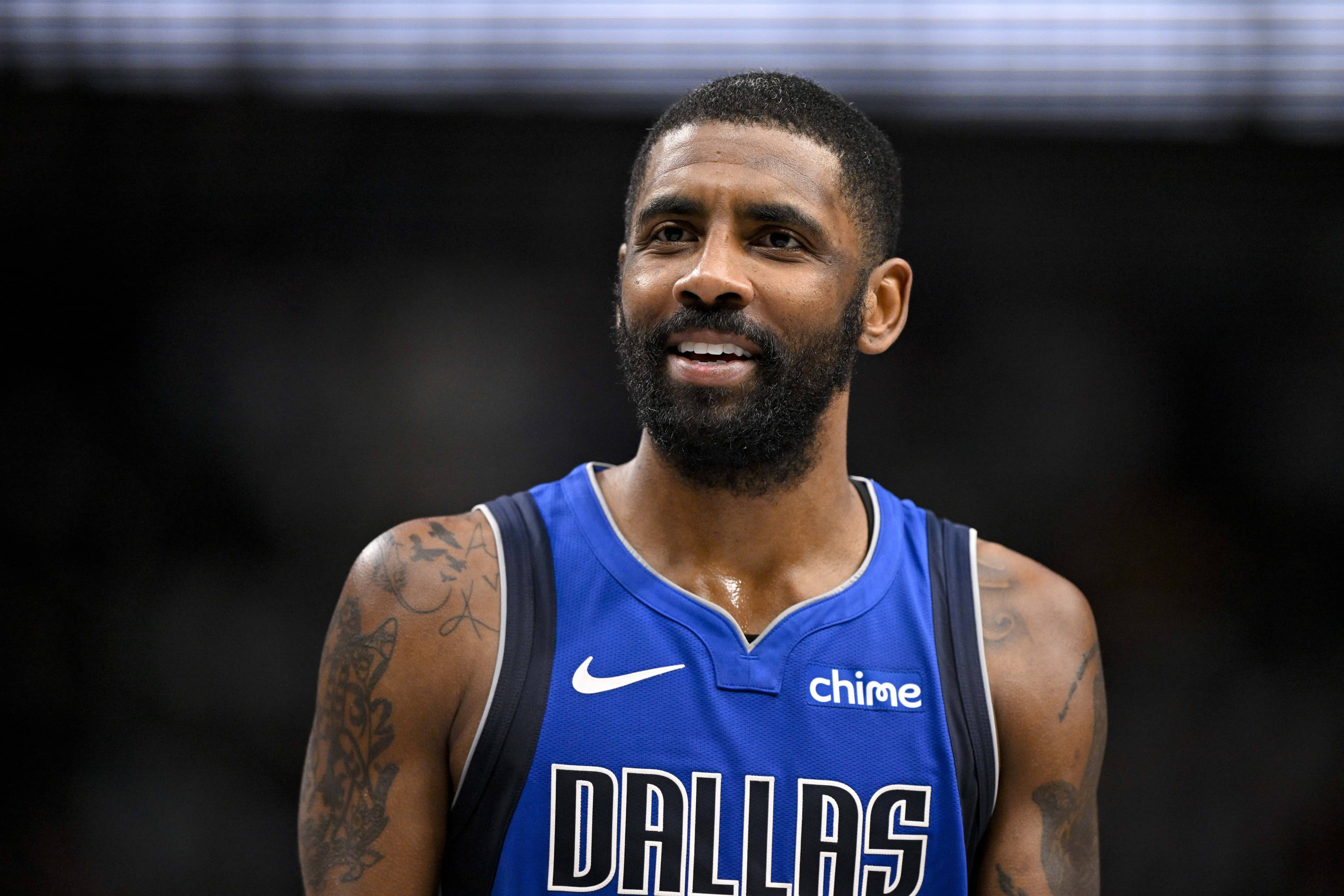 Dallas Mavericks guard Kyrie Irving (11) talks with the referees during the second quarter against the Oklahoma City Thunder at the American Airlines Center.
