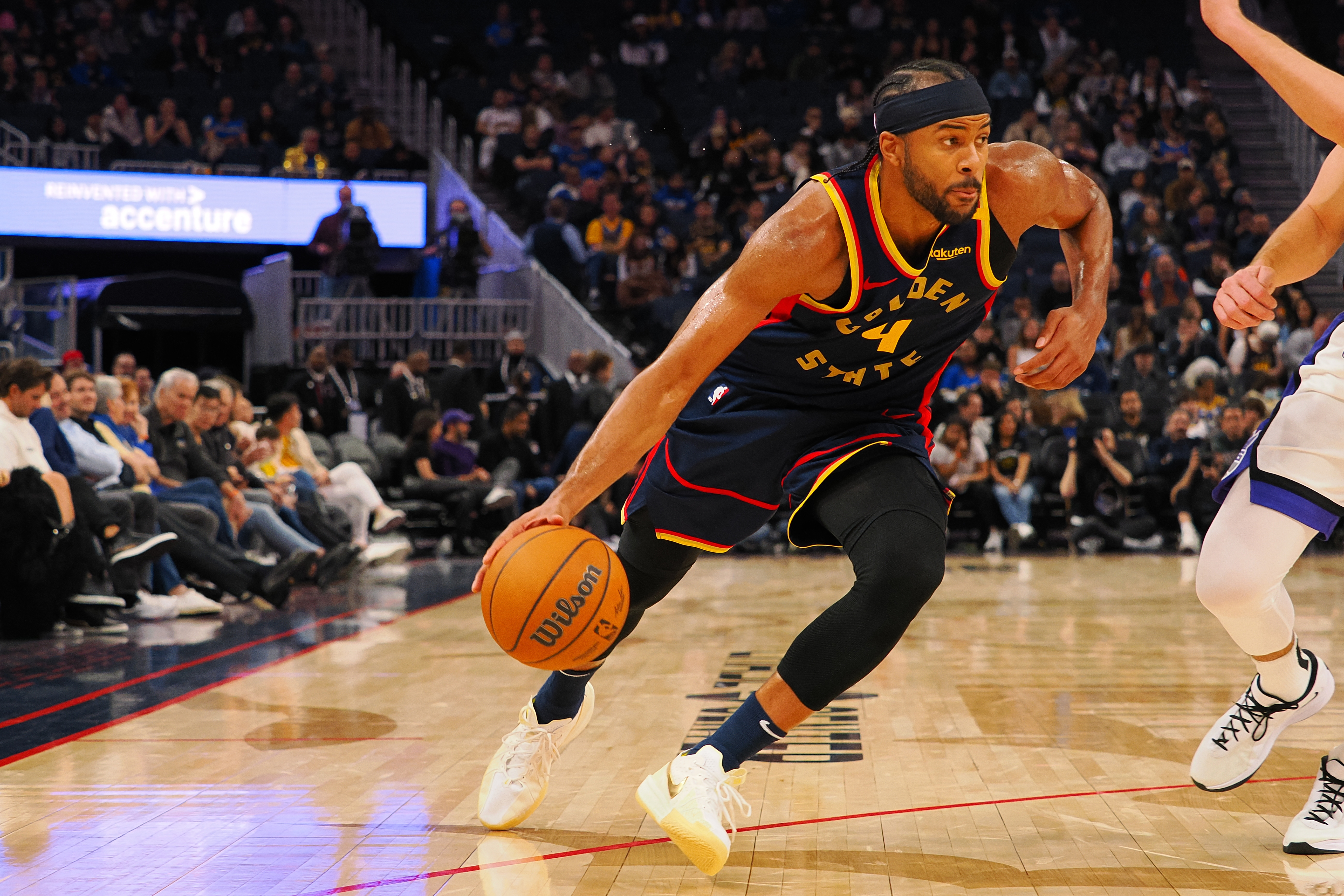 Jan 5, 2025; San Francisco, California, USA; Golden State Warriors guard Moses Moody (4) drives in against the Sacramento Kings during the fourth quarter at Chase Center. Mandatory Credit: Kelley L Cox-Imagn Images  