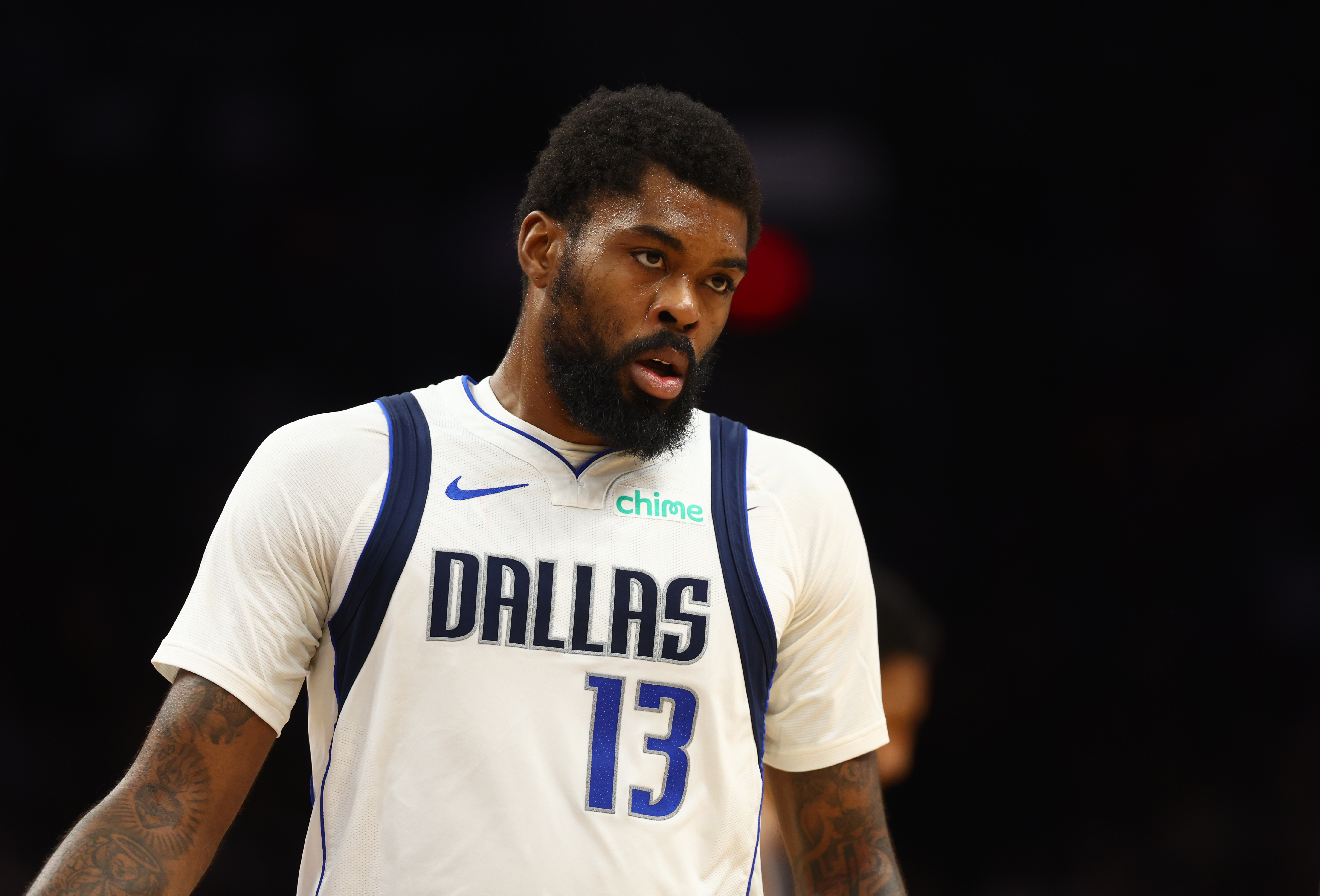 Dec 27, 2024; Phoenix, Arizona, USA; Dallas Mavericks forward Naji Marshall (13) against the Phoenix Suns at Footprint Center. Mandatory Credit: Mark J. Rebilas-Imagn Images  