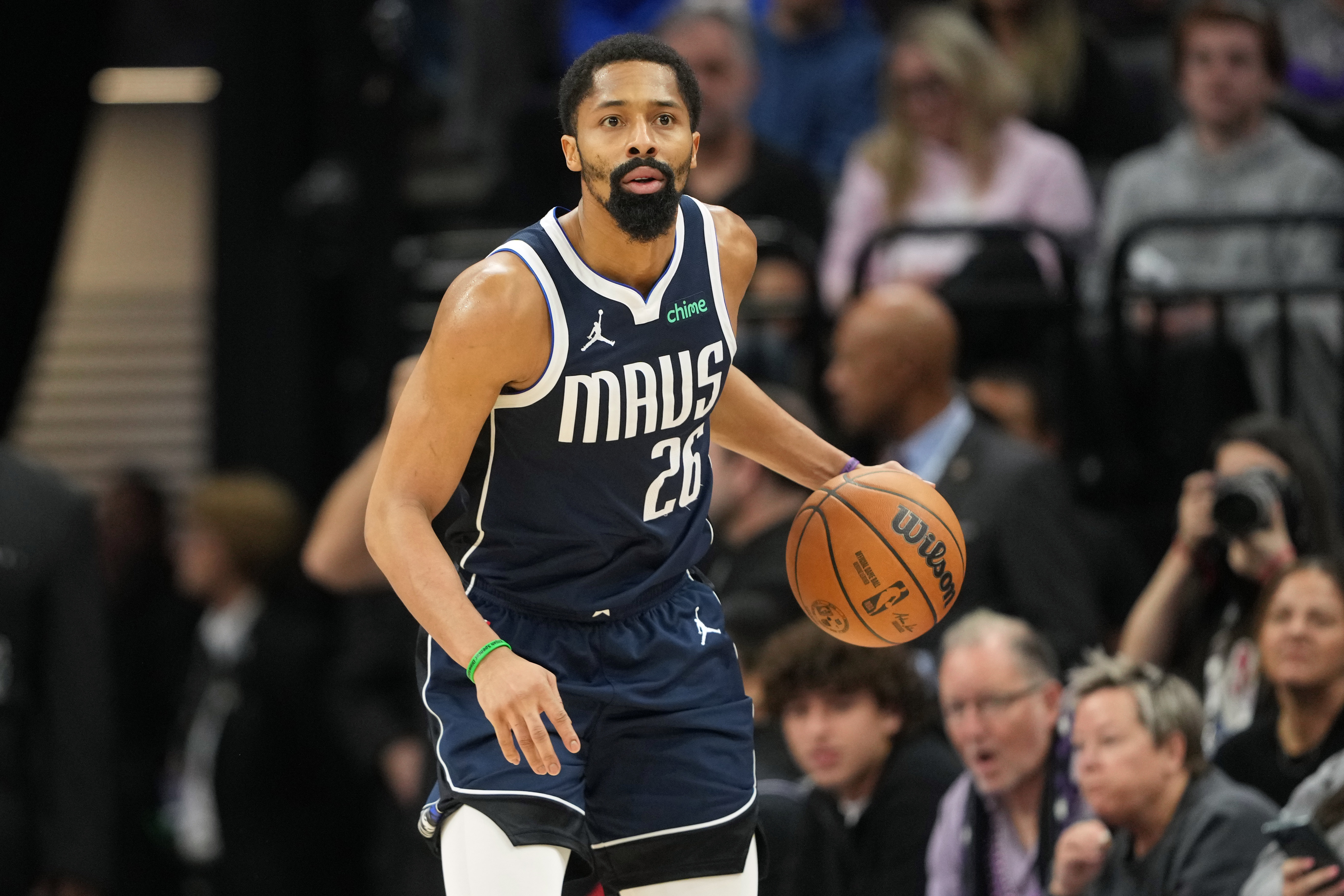 Dec 30, 2024; Sacramento, California, USA; Dallas Mavericks guard Spencer Dinwiddie (26) dribbles against the Sacramento Kings during the fourth quarter at Golden 1 Center. Mandatory Credit: Darren Yamashita-Imagn Images  