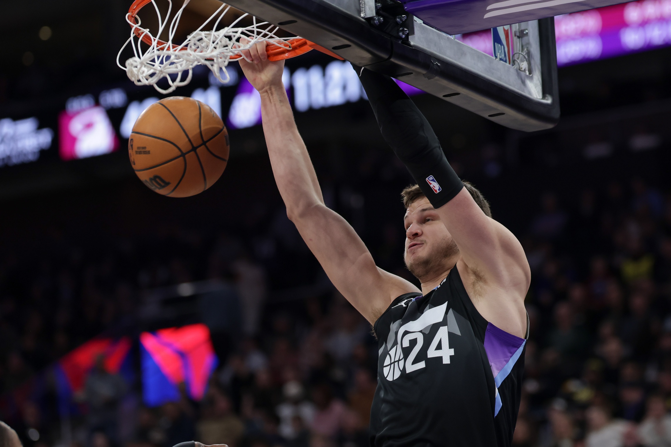Utah Jazz center Walker Kessler (24) dunks the ball against the Miami Heat during the second half at Delta Center. Mandatory Credit: Chris Nicoll-Imagn Images