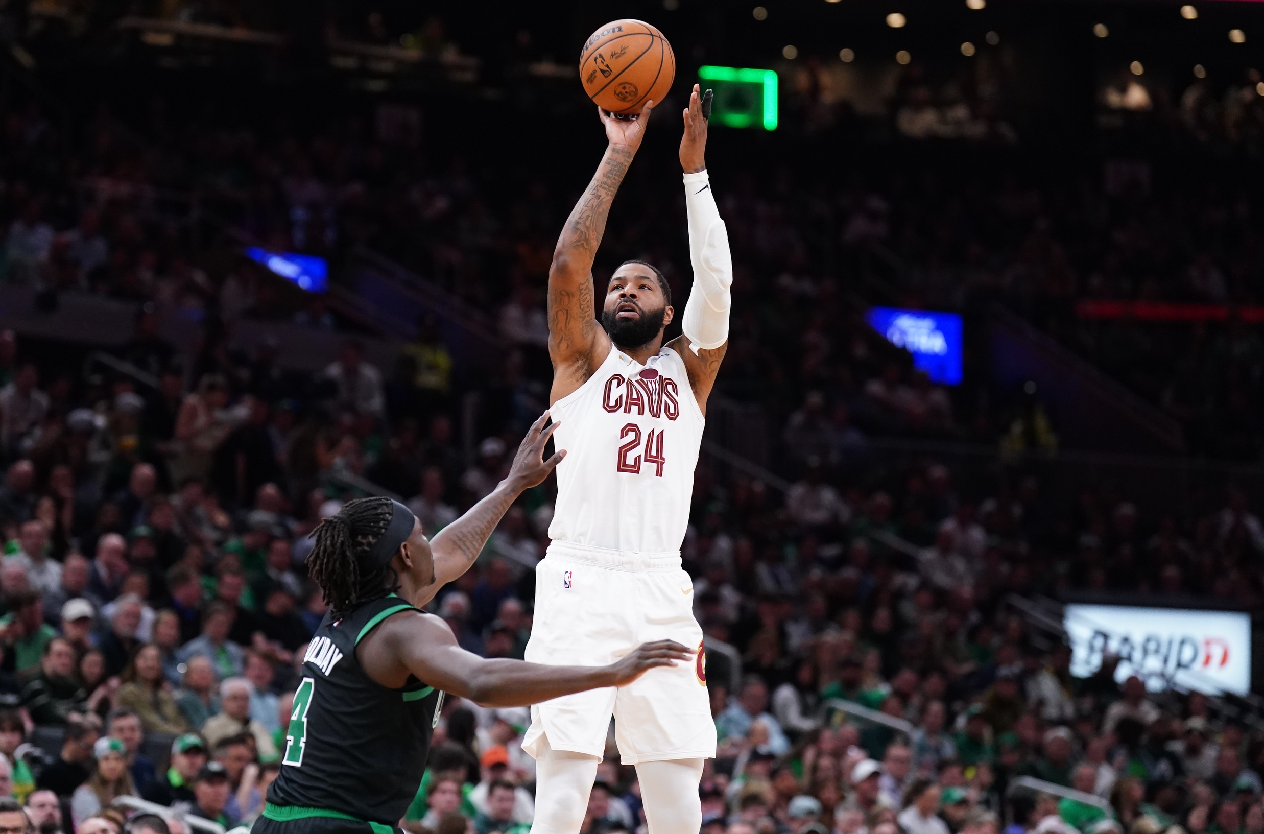 Cleveland Cavaliers forward Marcus Morris Sr. (24) shoots against Boston Celtics guard Jrue Holiday (4) in the second quarter during game five of the second round for the 2024 NBA playoffs at TD Garden. Mandatory Credit: David Butler II-Imagn Images