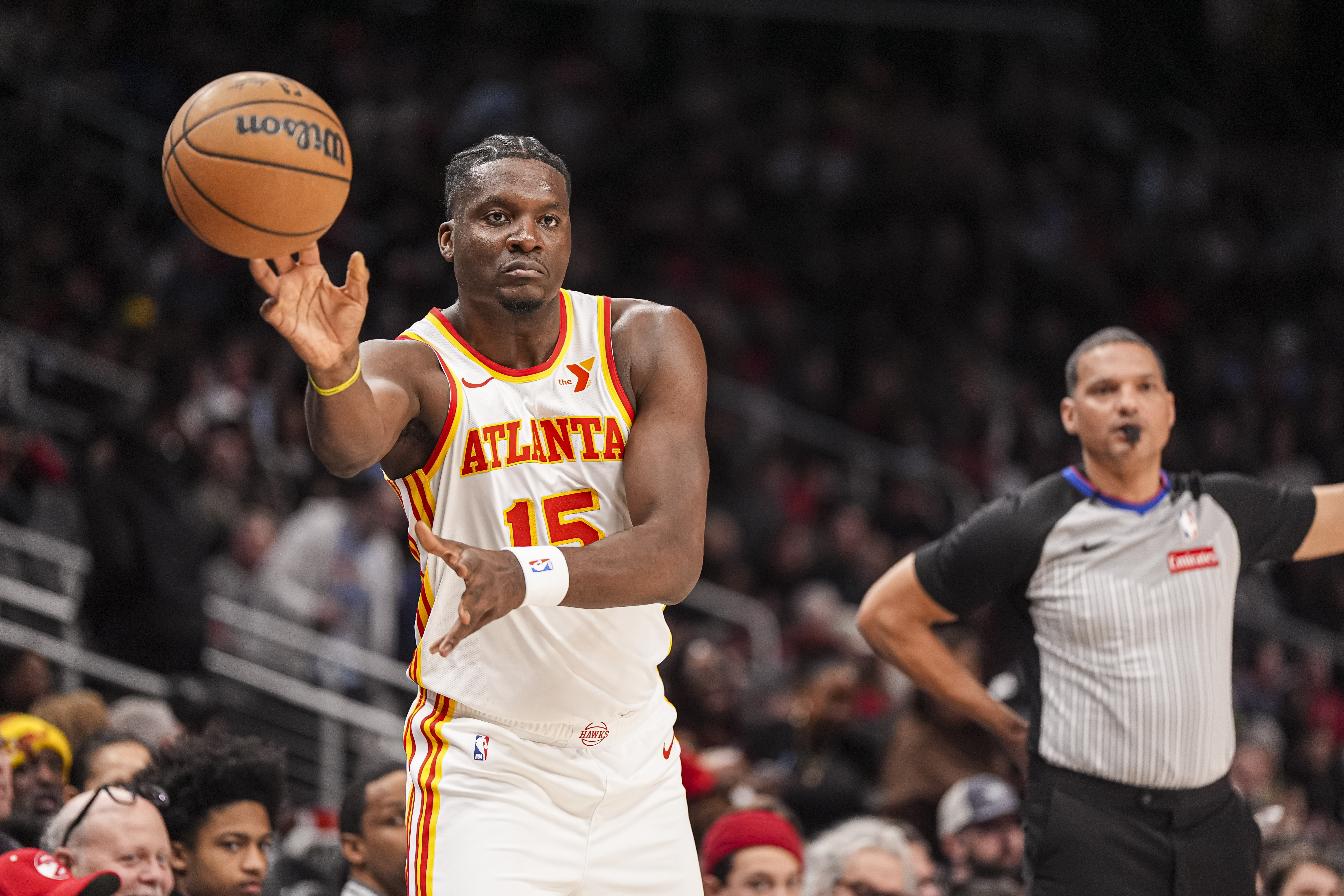 Jan 25, 2025; Atlanta, Georgia, USA; Atlanta Hawks center Clint Capela (15) inbounds the ball against the Toronto Raptors during the first half at State Farm Arena. Mandatory Credit: Dale Zanine-Imagn Images  