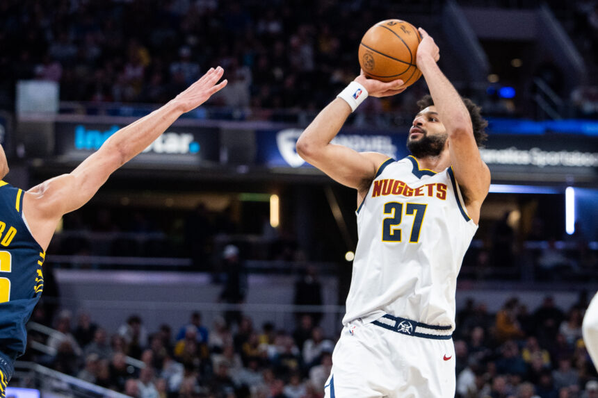 Denver Nuggets guard Jamal Murray (27) shoots the ball while Indiana Pacers guard Ben Sheppard (26) defends.