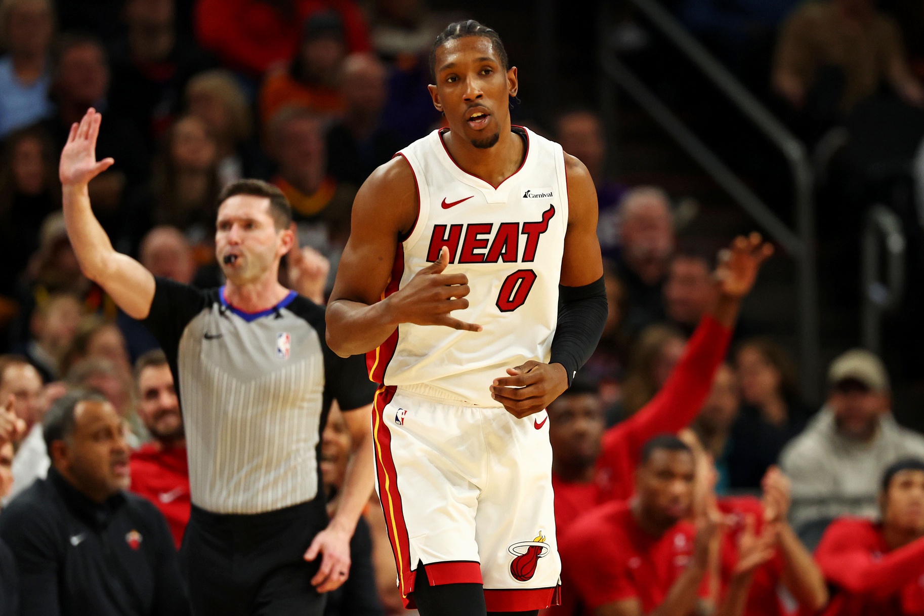 Jan 5, 2024; Phoenix, Arizona, USA; Miami Heat guard Josh Richardson (0) reacts after a play during the second quarter of the game against the Phoenix Suns at Footprint Center. Mandatory Credit: Mark J. Rebilas-Imagn Images