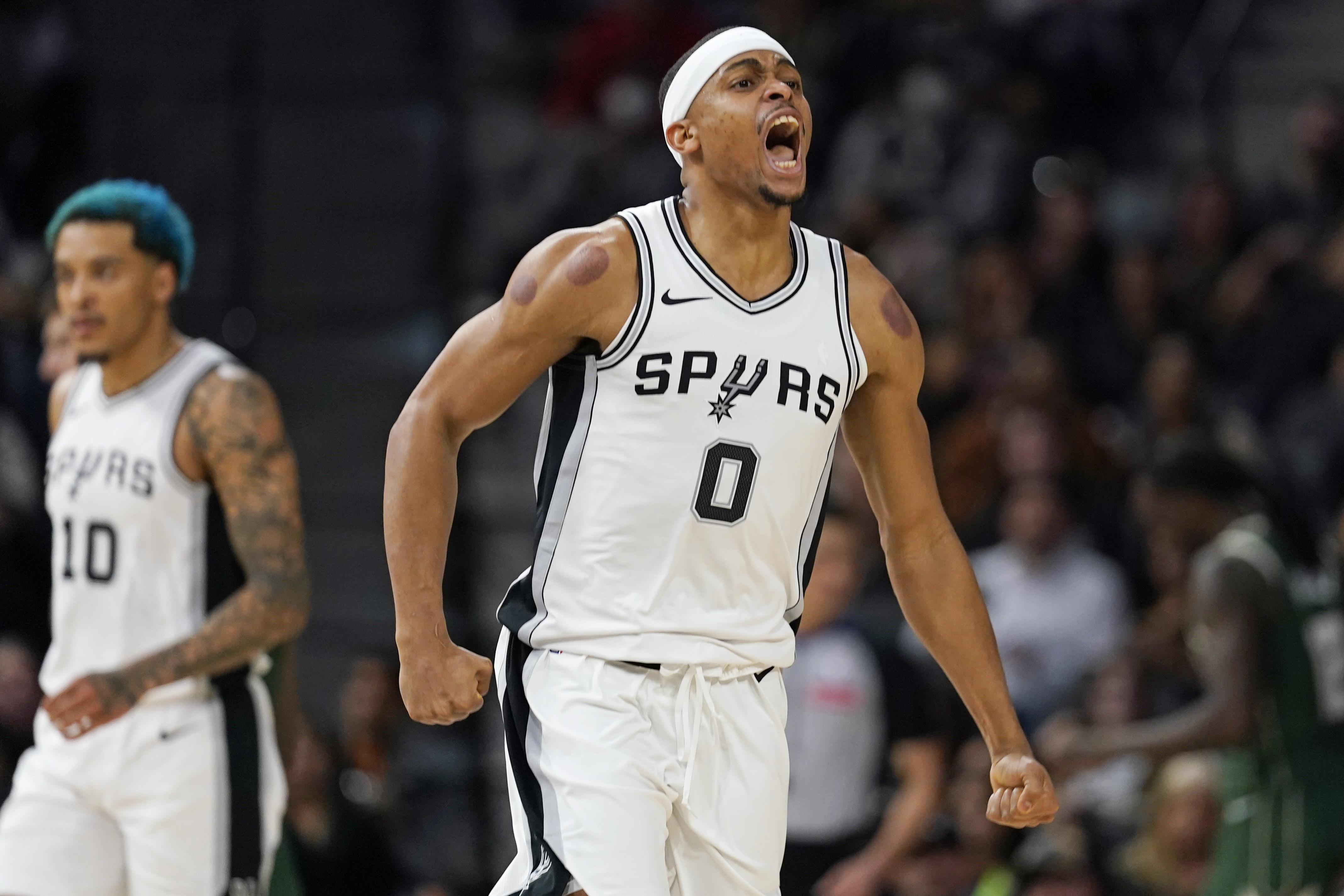 Jan 31, 2025; San Antonio, Texas, USA; San Antonio Spurs forward Keldon Johnson (0) reacts after scoring during the second half against the Milwaukee Bucks at Frost Bank Center. Mandatory Credit: Scott Wachter-Imagn Images  