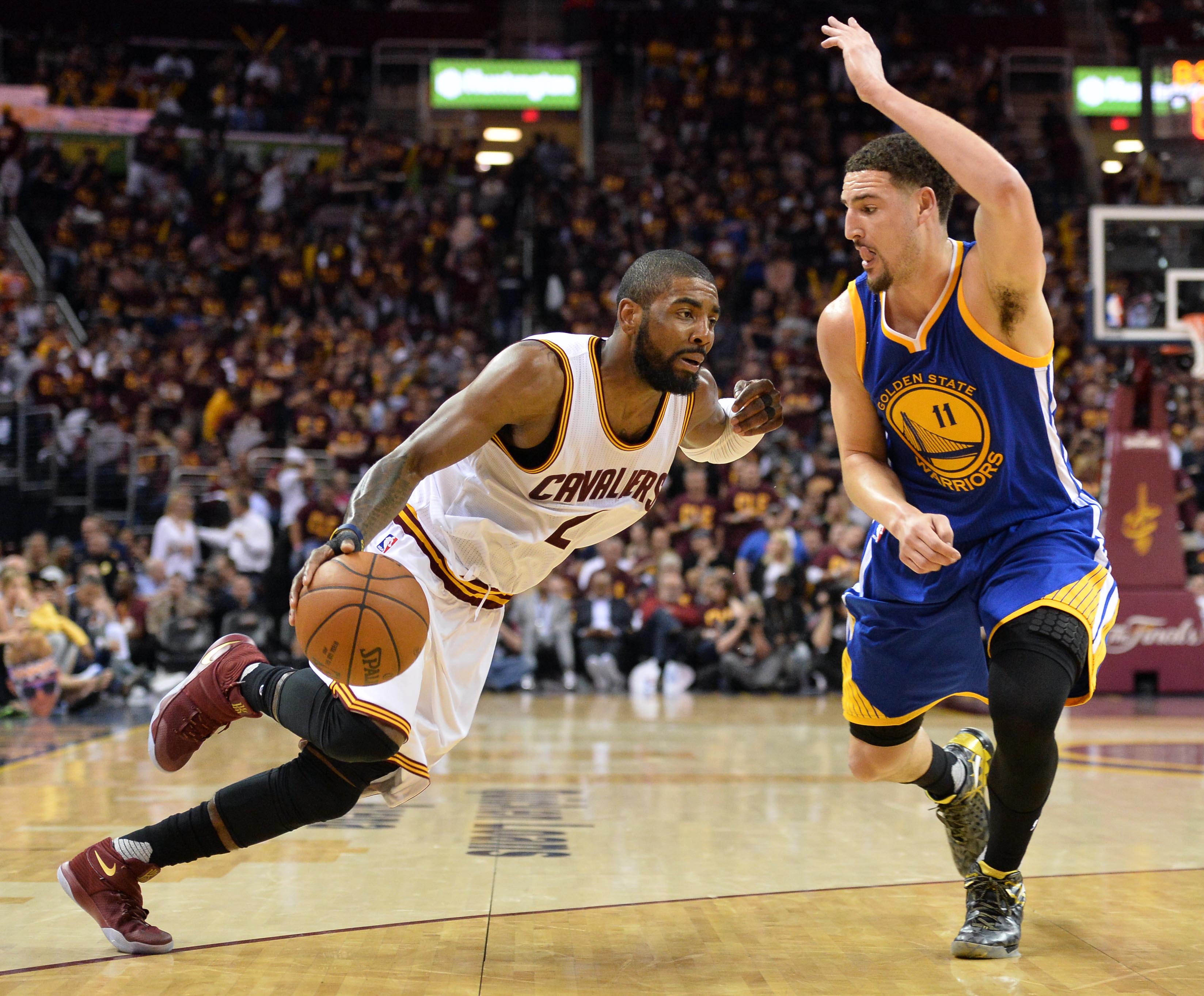 Jun 10, 2016; Cleveland, OH, USA; Cleveland Cavaliers guard Kyrie Irving (2) drives to the basket against Golden State Warriors guard Klay Thompson (11) during the third quarter in game four of the NBA Finals at Quicken Loans Arena. Mandatory Credit: Ken Blaze-Imagn Images  