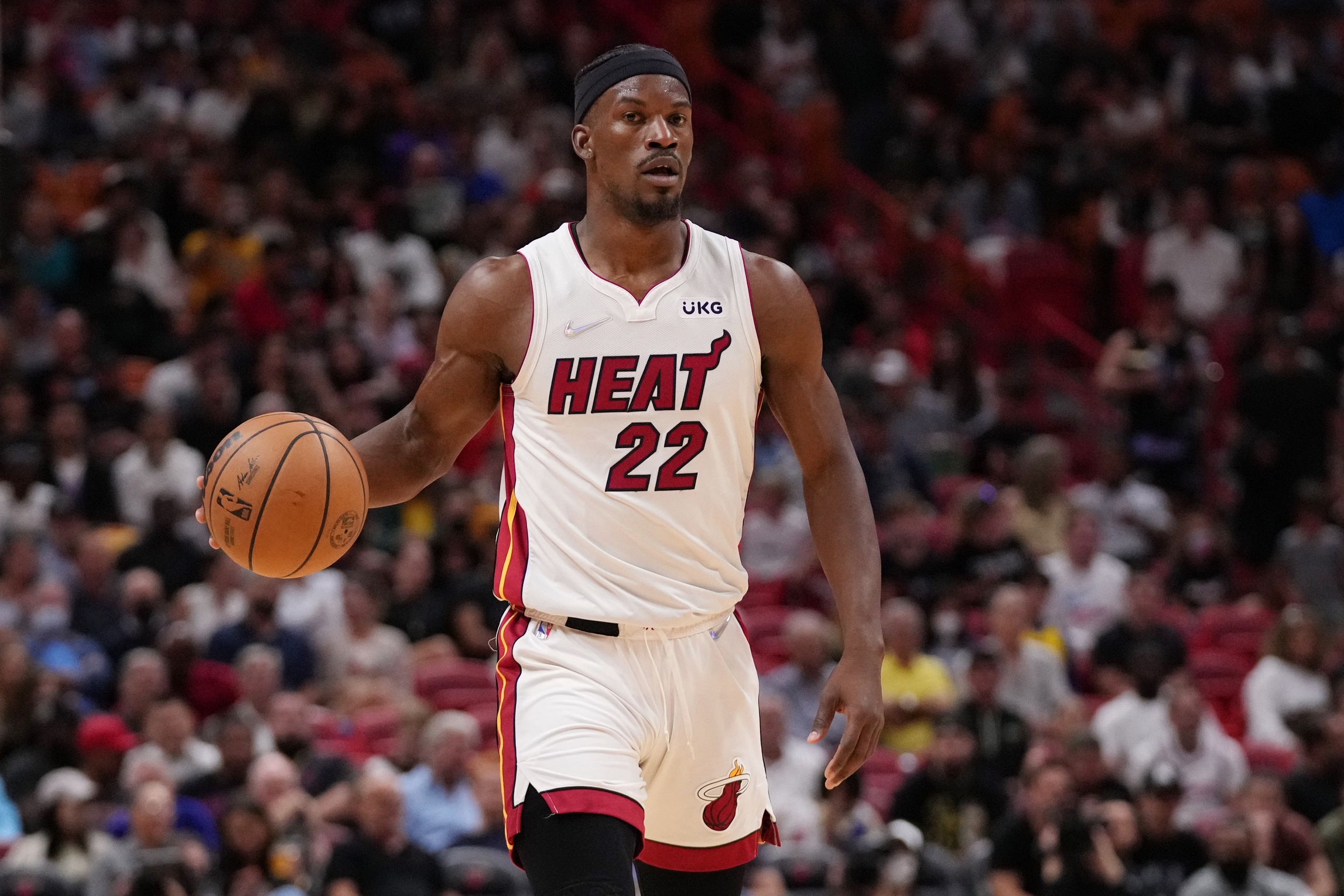 Miami Heat forward Jimmy Butler (22) dribbles the ball up the court against the Golden State Warriors during the first half at FTX Arena. Mandatory Credit: Jasen Vinlove-Imagn Images