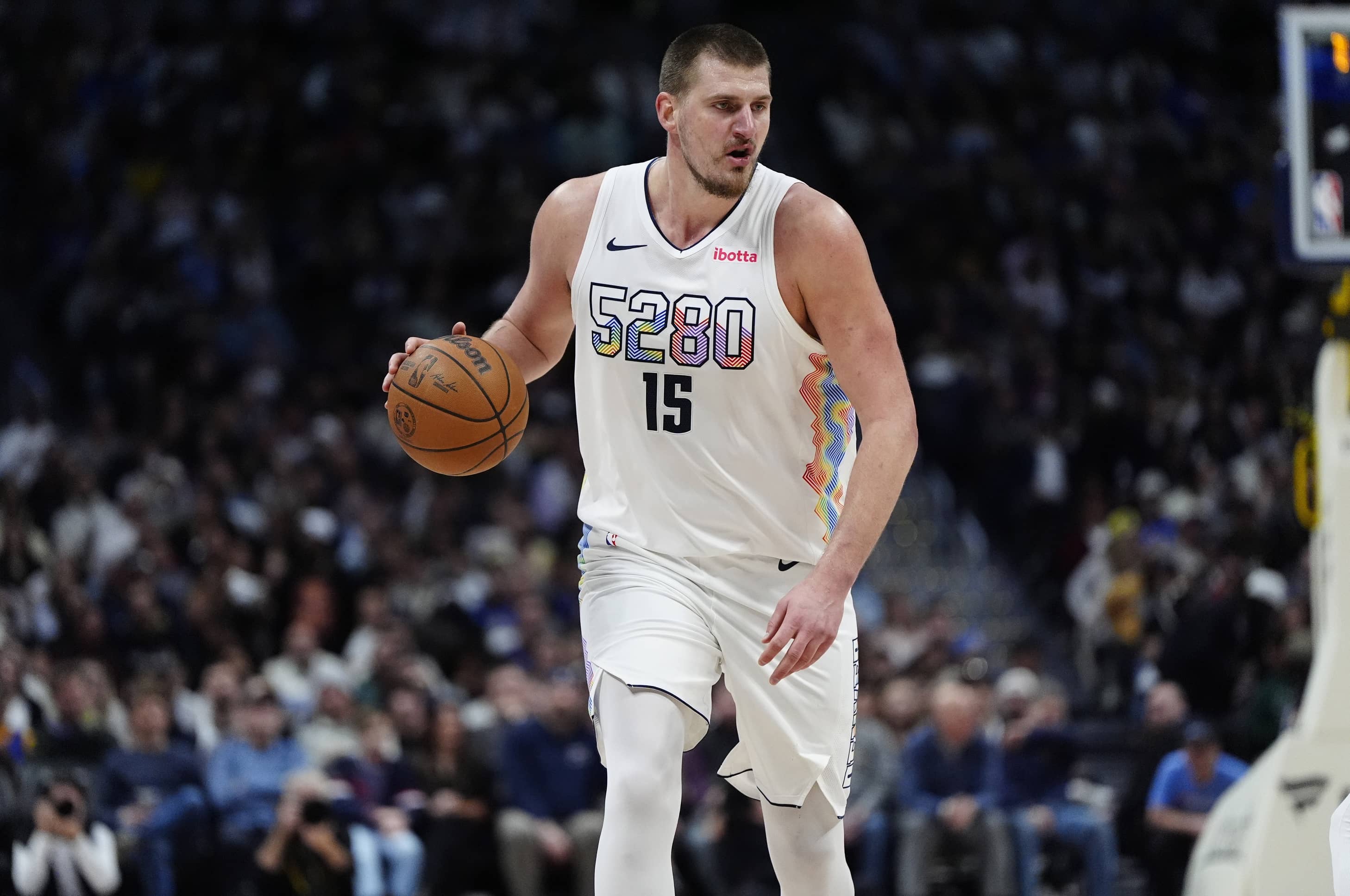 Denver Nuggets center Nikola Jokic (15) controls the ball in the second half against the New Orleans Pelicans at Ball Arena.
