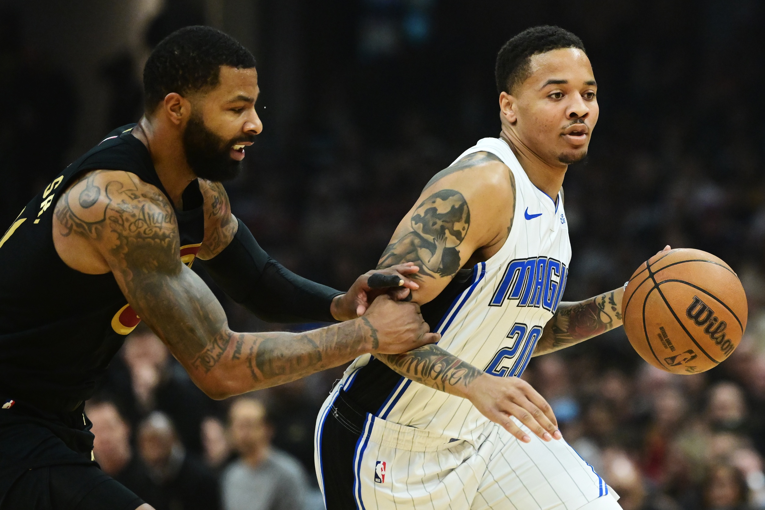  Orlando Magic guard Markelle Fultz (20) drives to the basket against Cleveland Cavaliers forward Marcus Morris Sr. (24) during the first half in game seven of the first round for the 2024 NBA playoffs at Rocket Mortgage FieldHouse. Mandatory Credit: Ken Blaze-Imagn Images