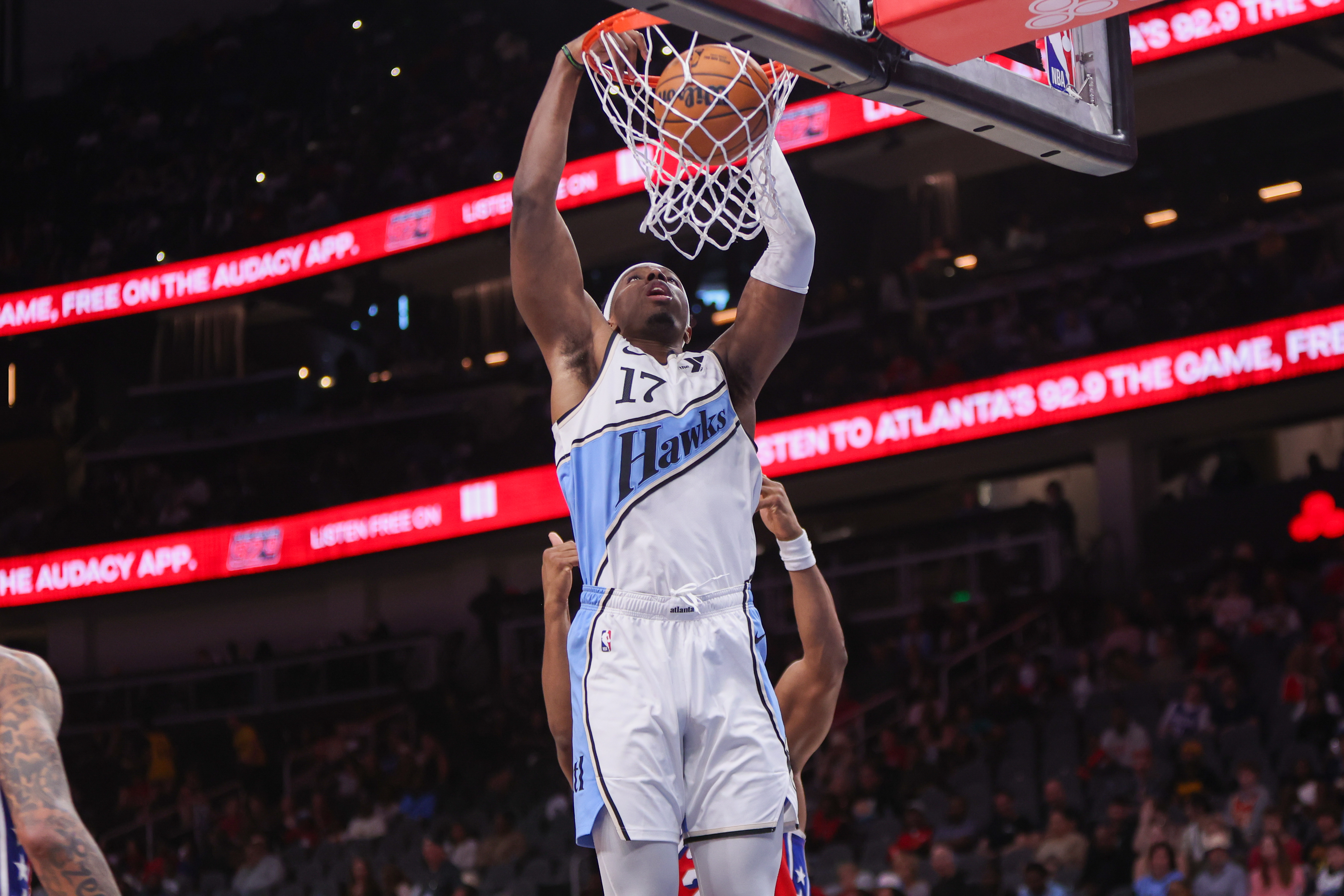 Mar 23, 2025; Atlanta, Georgia, USA; Atlanta Hawks forward Onyeka Okongwu (17) dunks against the Philadelphia 76ers in the third quarter at State Farm Arena. Mandatory Credit: Brett Davis-Imagn Images  