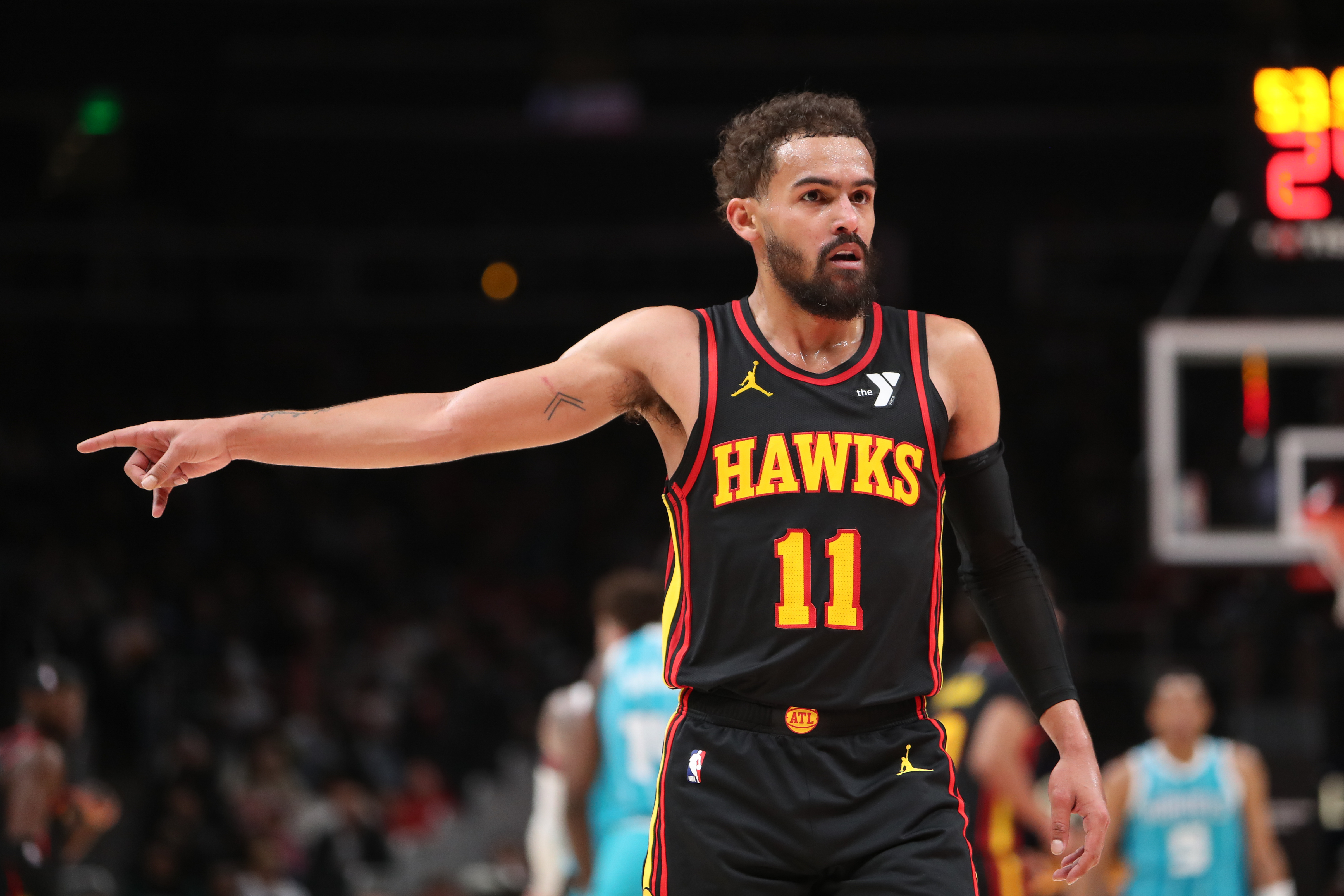 Mar 12, 2025; Atlanta, Georgia, USA; Atlanta Hawks guard Trae Young (11) points to the referee against the Charlotte Hornets during the second half at State Farm Arena. Mandatory Credit: Mady Mertens-Imagn Images  