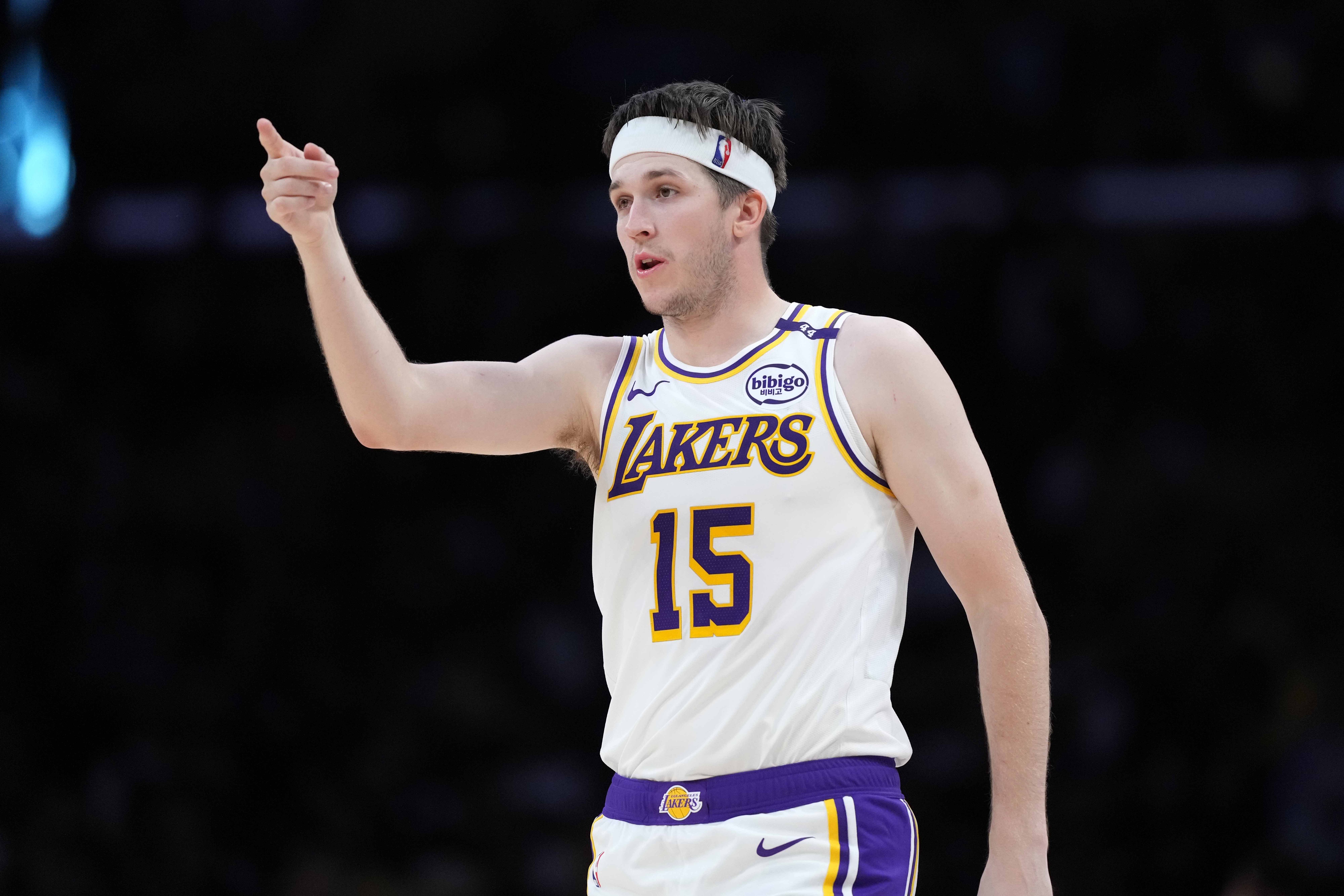 Los Angeles, California, USA; Los Angeles Lakers guard Austin Reaves (15) gestures against the Phoenix Suns in the second half at Crypto.com Arena. Mandatory Credit: Kirby Lee-Imagn Images