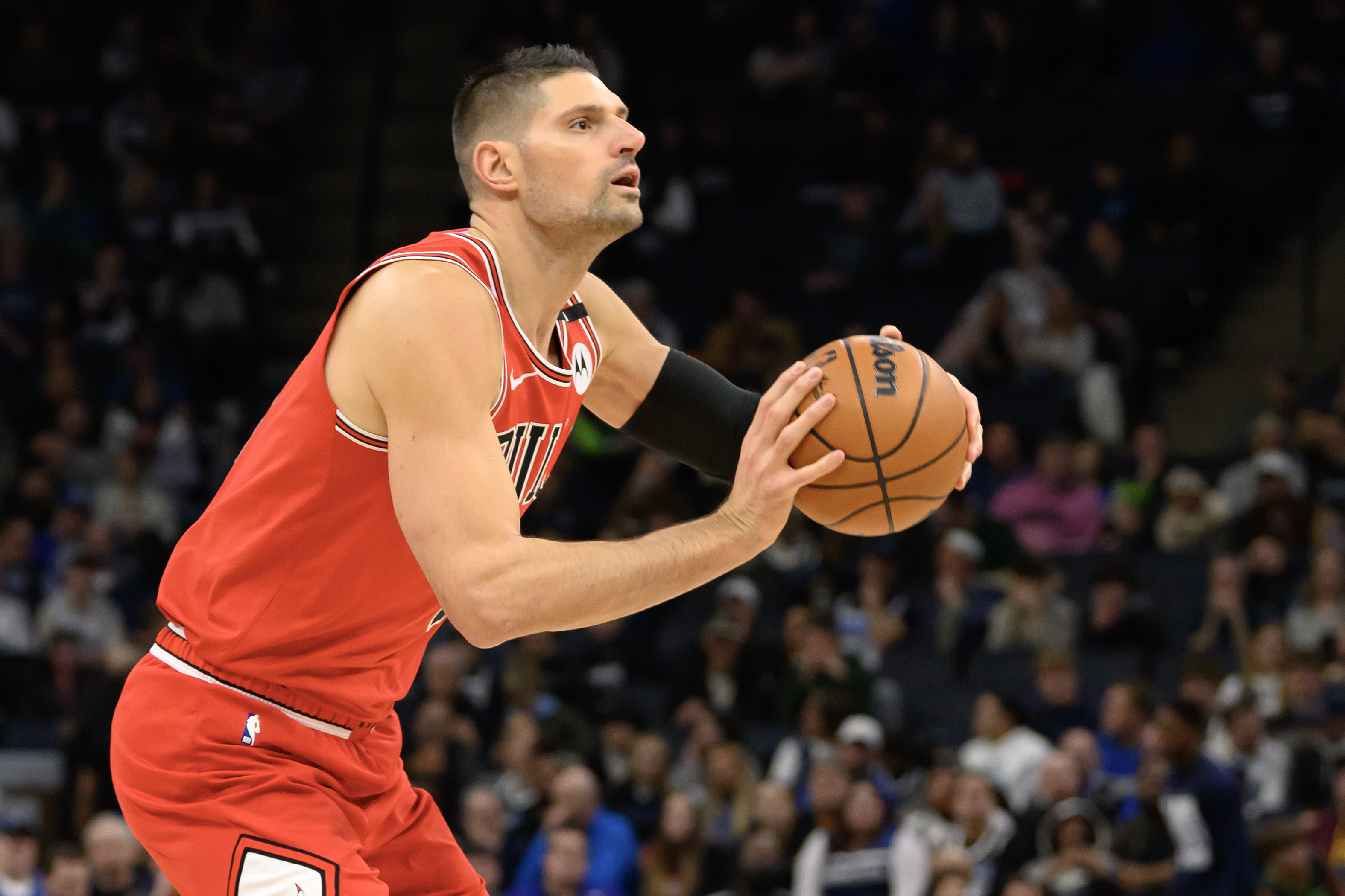 Feb 5, 2025; Minneapolis, Minnesota, USA; Chicago Bulls center Nikola Vucevic (9) shoots the ball against the Minnesota Timberwolves during the first quarter at Target Center. Mandatory Credit: Nick Wosika-Imagn Images  