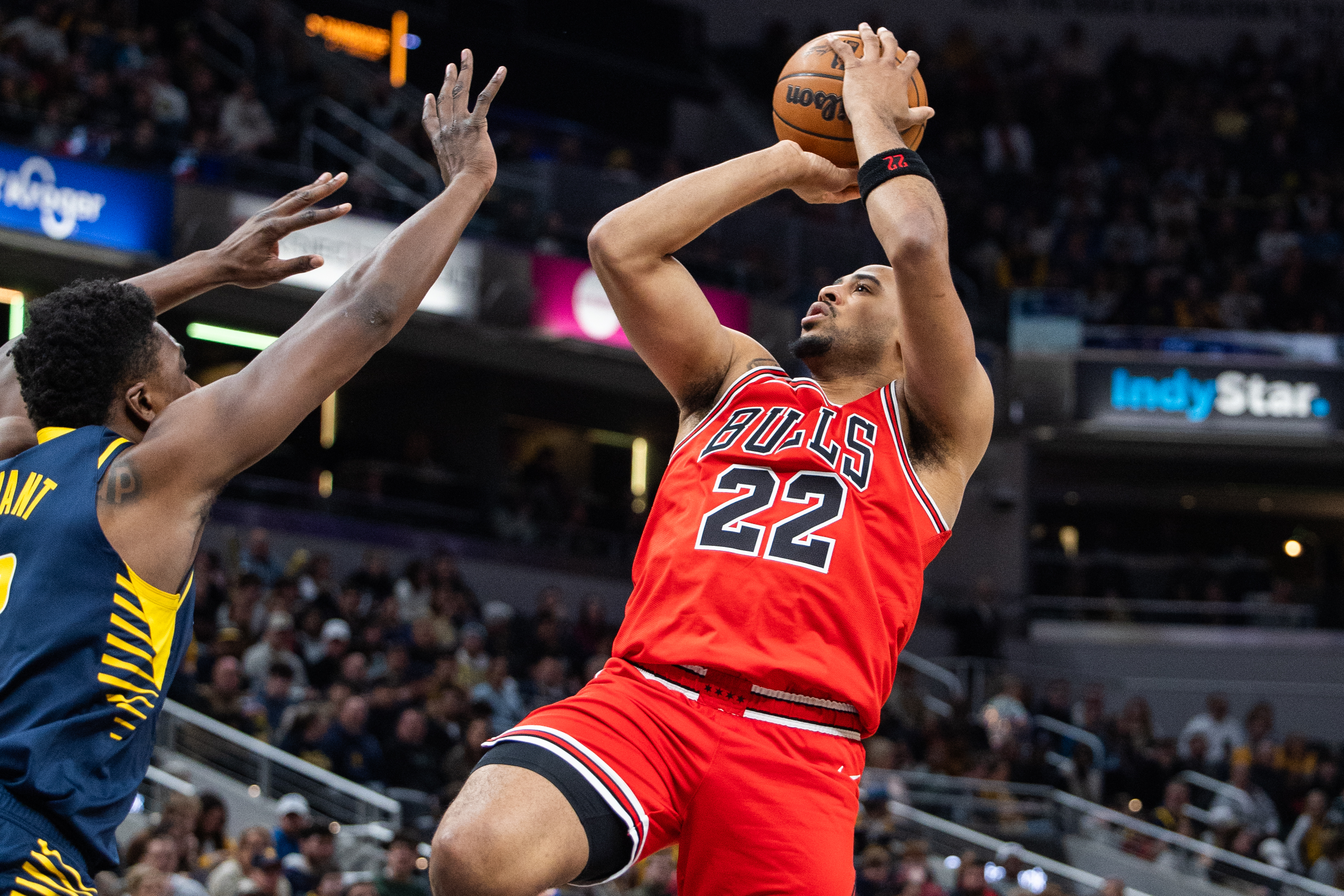 Mar 2, 2025; Indianapolis, Indiana, USA; Chicago Bulls forward Talen Horton-Tucker (22) shoots the ball while Indiana Pacers center Thomas Bryant (3) defends in the first half at Gainbridge Fieldhouse. Mandatory Credit: Trevor Ruszkowski-Imagn Images  