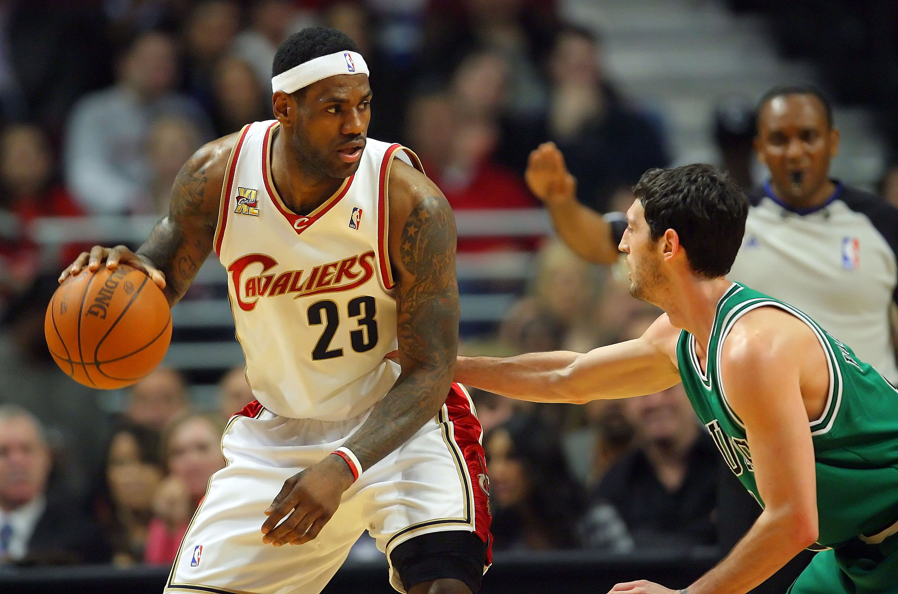 Mar 19, 2010; Chicago, IL, USA; Cleveland Cavaliers forward LeBron James (23) being defended by Chicago Bulls guard Kirk Hinrich (12) during the first half at the United Center. The Cavaliers defeated the Bulls 92-85. Mandatory Credit: Dennis Wierzbicki-Imagn Images  