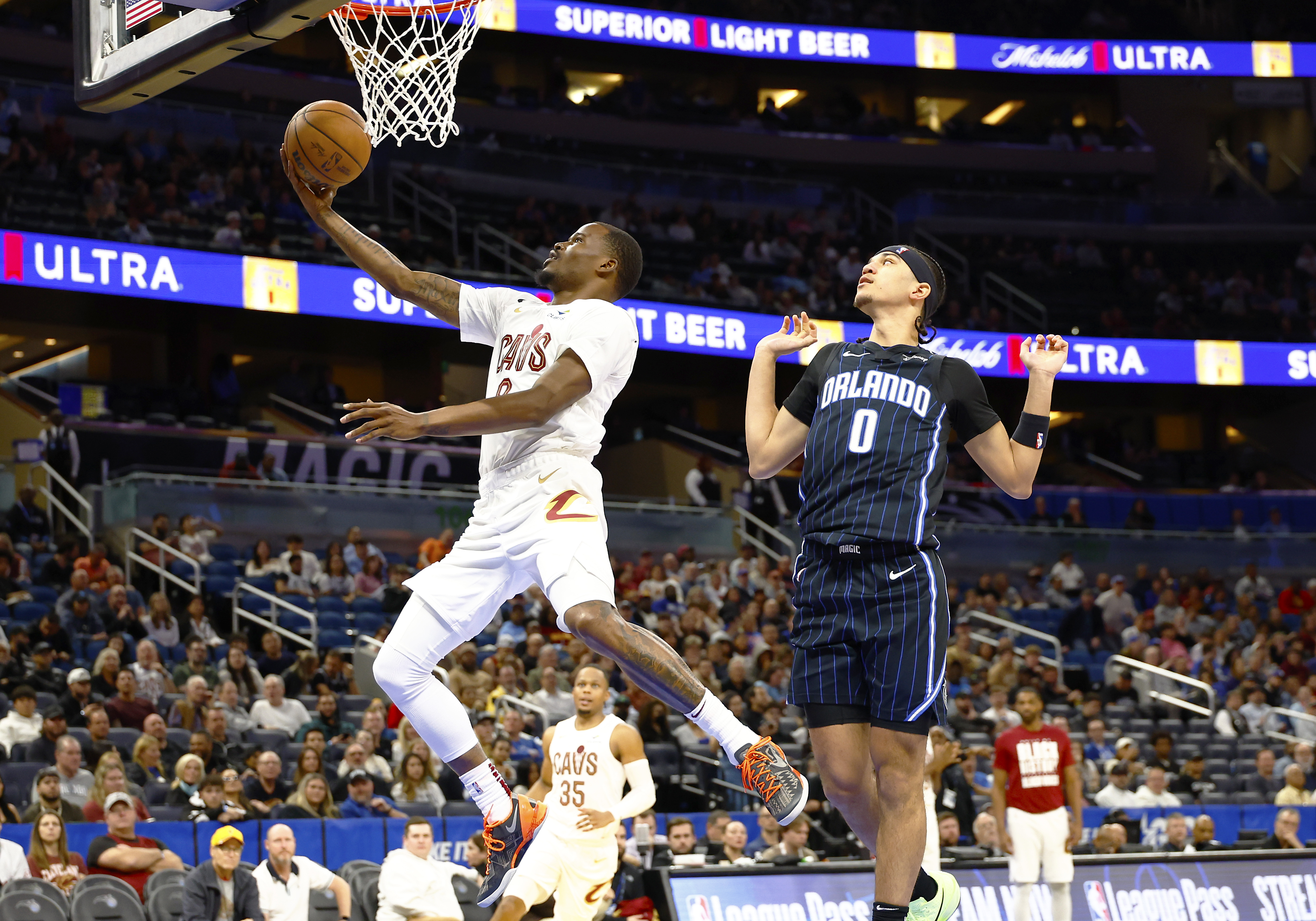 Feb 25, 2025; Orlando, Florida, USA; Cleveland Cavaliers guard Javonte Green (8) takes a shot as Orlando Magic guard Anthony Black (0) watches during the second half at Kia Center. Mandatory Credit: Russell Lansford-Imagn Images  