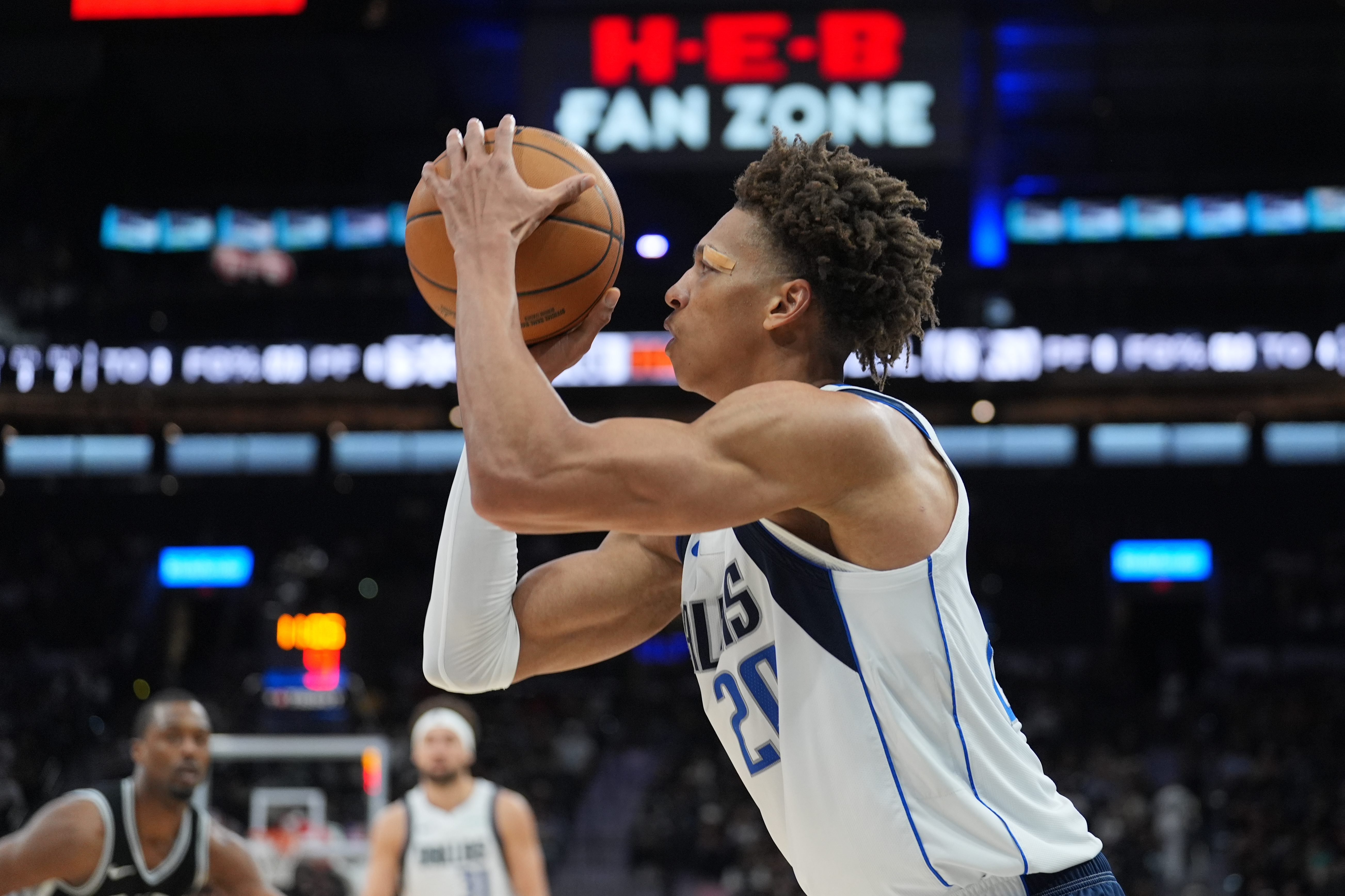Mar 10, 2025; San Antonio, Texas, USA; Dallas Mavericks forward Kessler Edwards (20) shoots in the second half against the San Antonio Spurs at Frost Bank Center. Mandatory Credit: Daniel Dunn-Imagn Images  
