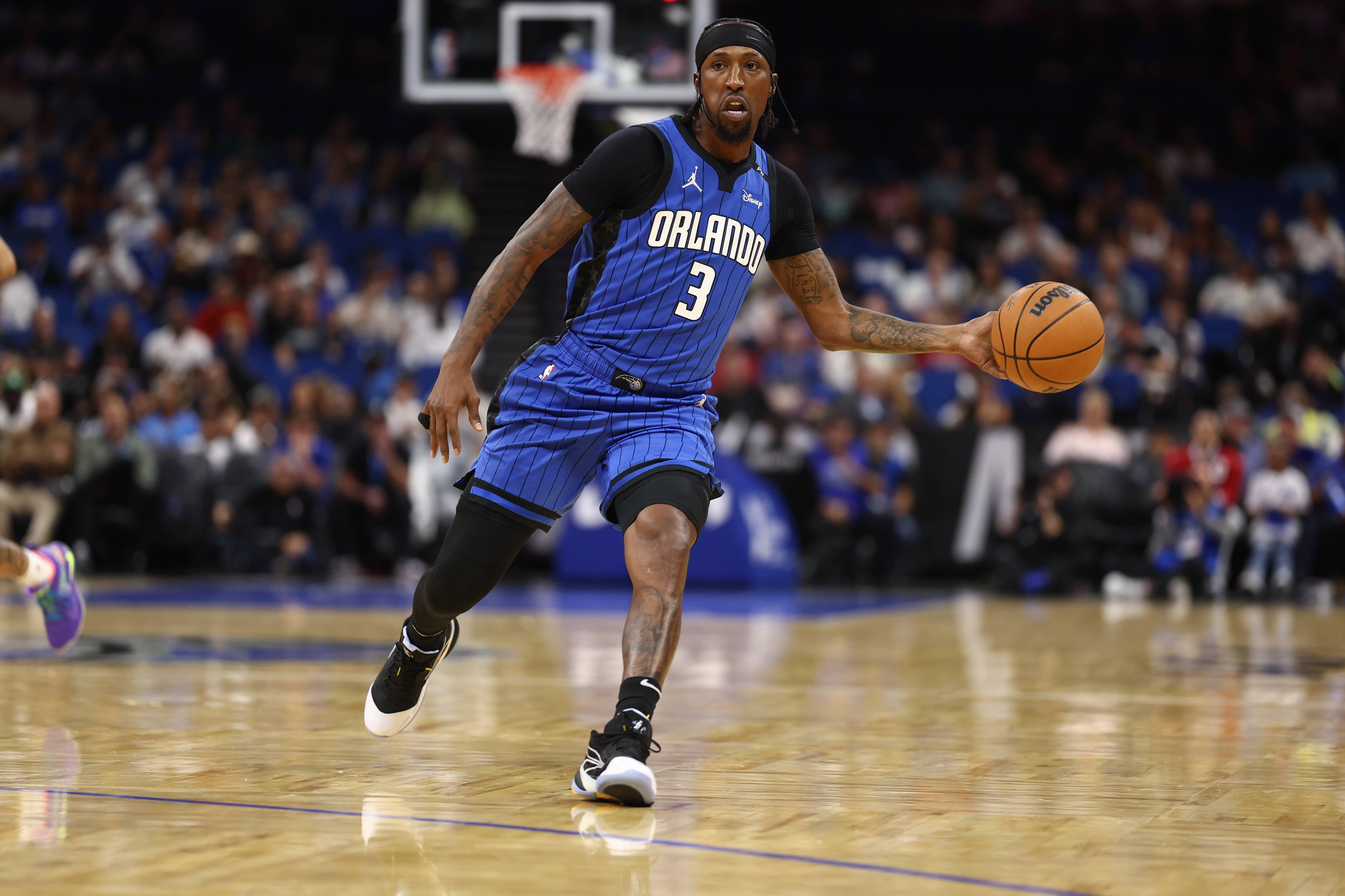 Orlando, Florida, USA; Orlando Magic guard Kentavious Caldwell-Pope (3) passes the ball against the New Orleans Pelicans in the first quarter at Kia Center. Mandatory Credit: Nathan Ray Seebeck-Imagn Images