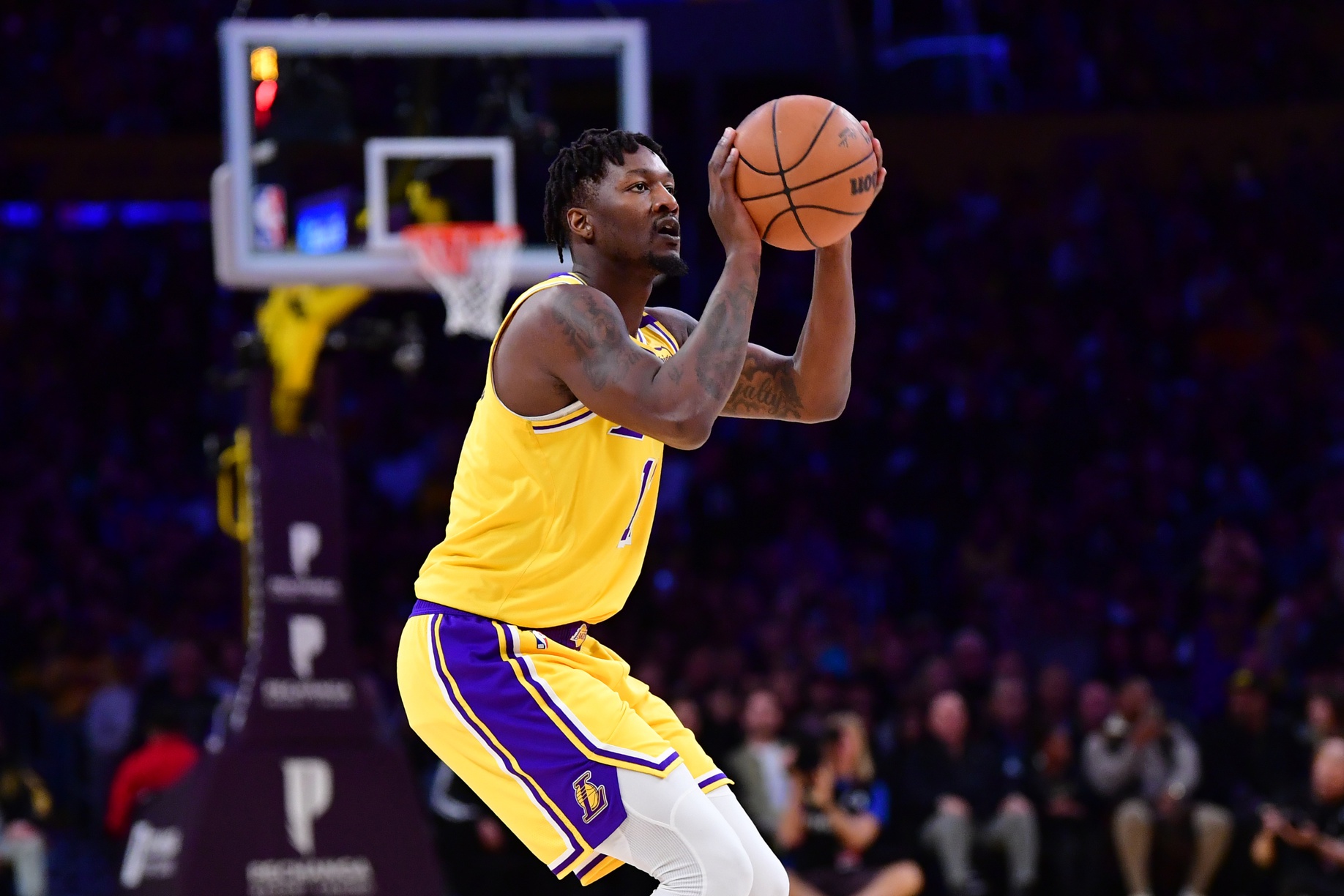 Los Angeles Lakers forward Dorian Finney-Smith (17) shoots three-point basket against the against the New Orleans Pelicans during the first half at Crypto.com Arena. Mandatory Credit: Gary A. Vasquez-Imagn Images