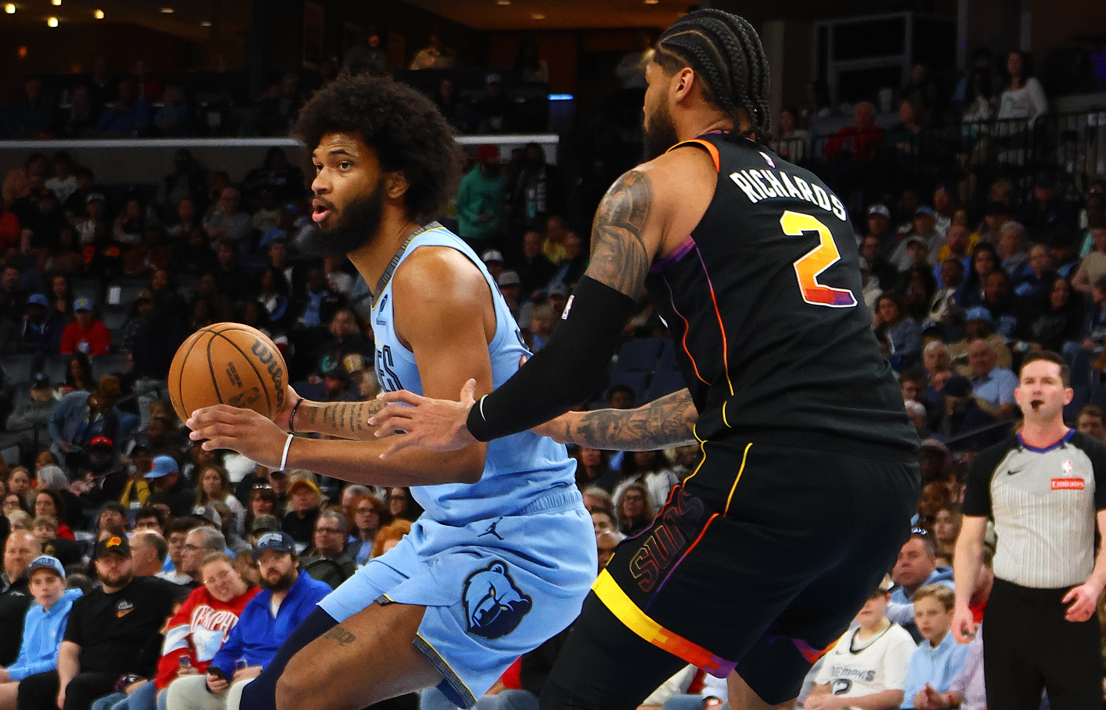 Mar 10, 2025; Memphis, Tennessee, USA; Memphis Grizzlies forward Marvin Bagley III (35) handles the ball as Phoenix Suns center Nick Richards (2) defends during the first quarter at FedExForum. Mandatory Credit: Petre Thomas-Imagn Images  