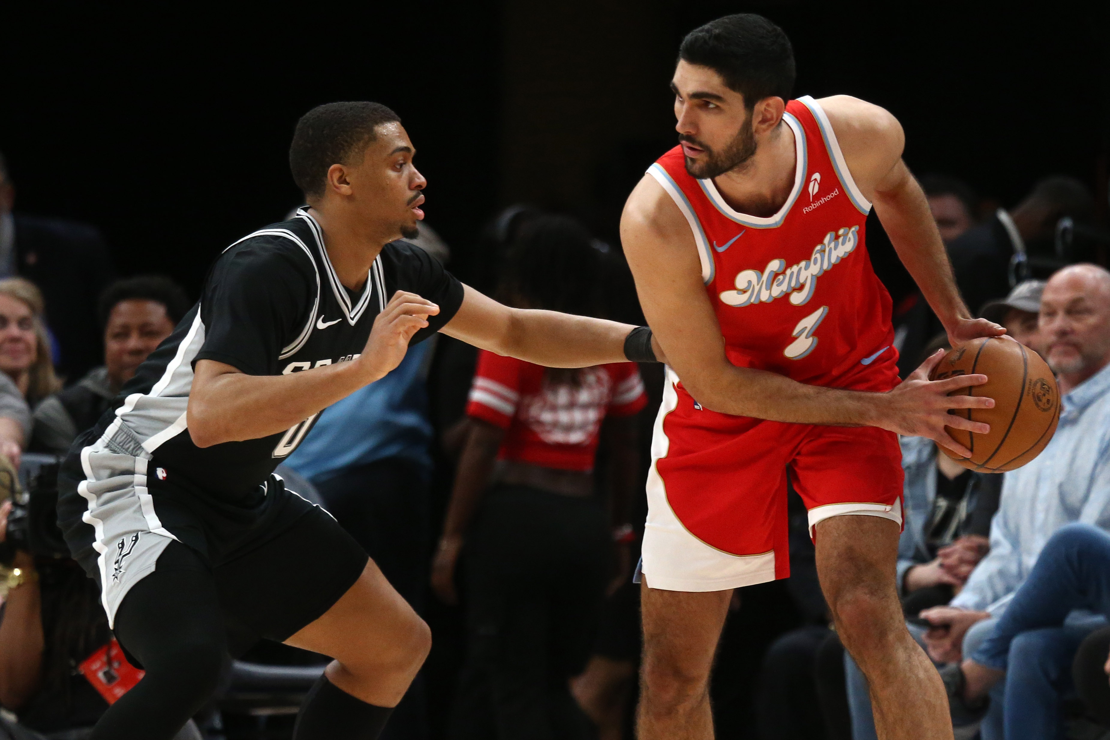Mar 1, 2025; Memphis, Tennessee, USA; Memphis Grizzlies forward Santi Aldama (7) handles the ball as San Antonio Spurs forward Keldon Johnson (0) defends during the fourth quarter at FedExForum. Mandatory Credit: Petre Thomas-Imagn Images  