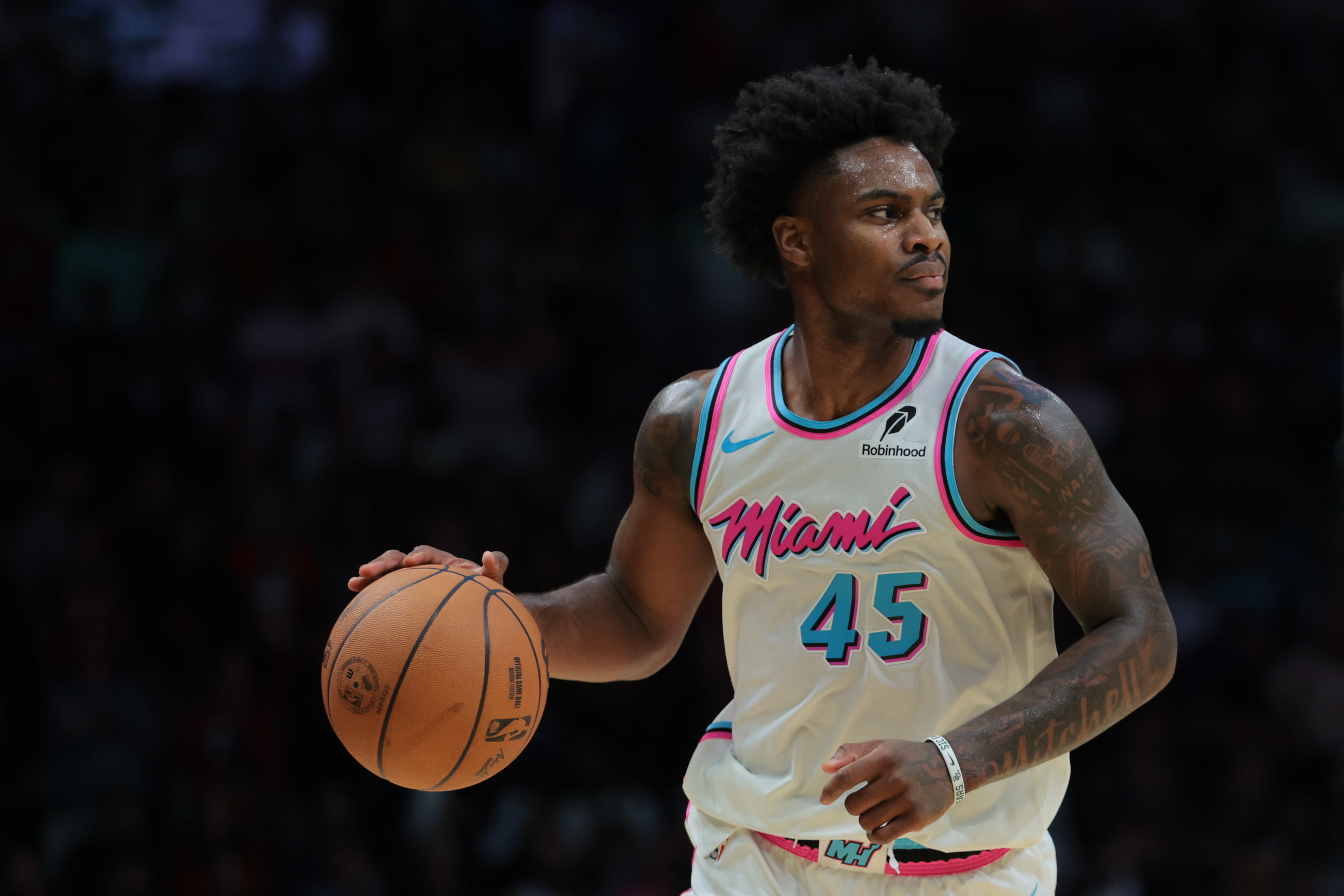Feb 28, 2025; Miami, Florida, USA; Miami Heat guard Davion Mitchell (45) dribbles the basketball against the Indiana Pacers during the fourth quarter at Kaseya Center. Mandatory Credit: Sam Navarro-Imagn Images  